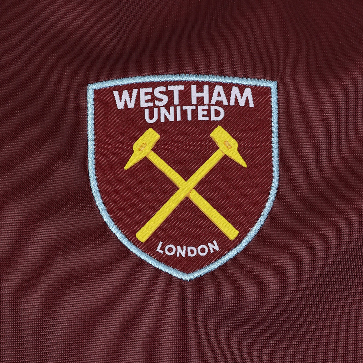 West Ham adults retro track jacket in navy blue with club crest to chest.