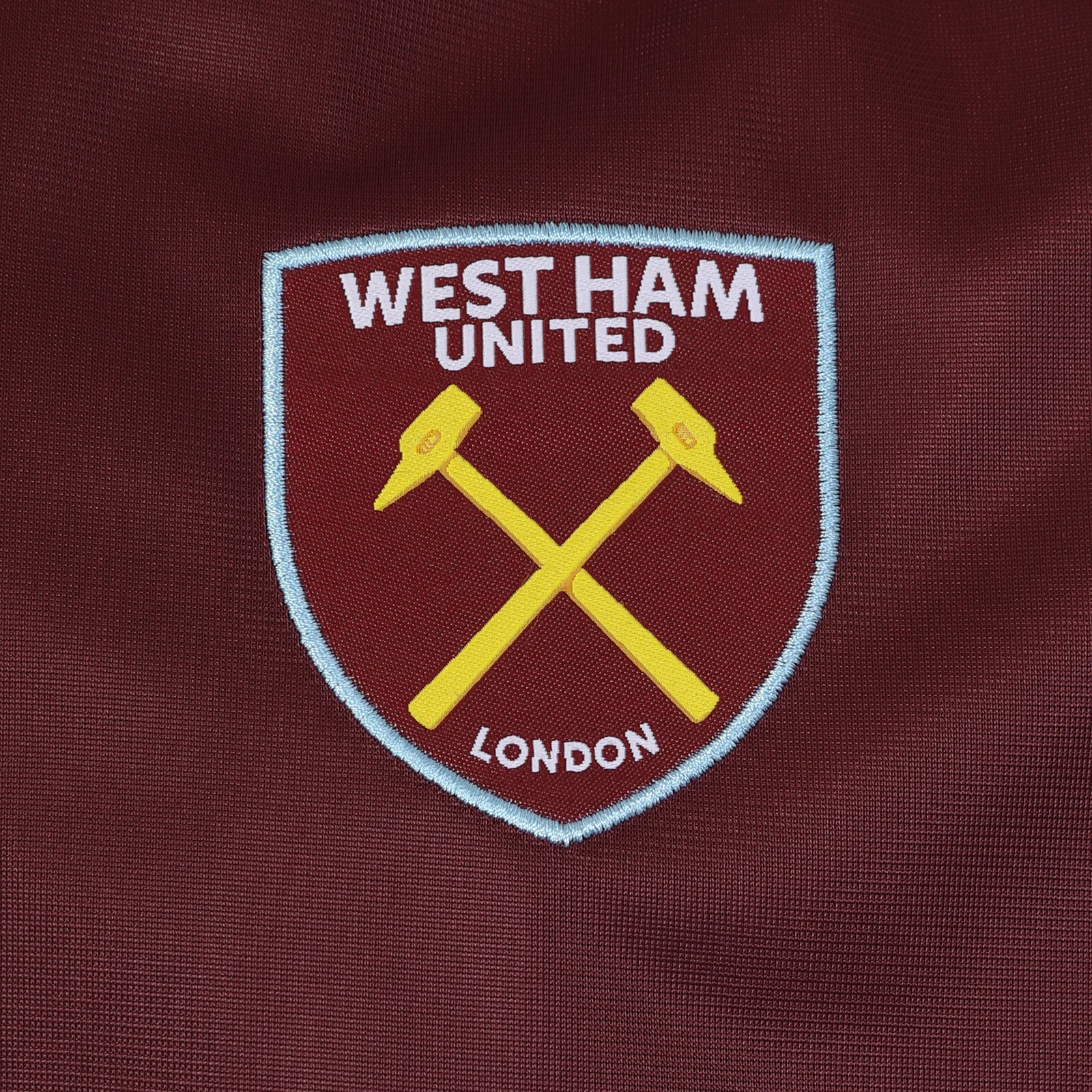West Ham adults retro track jacket in navy blue with club crest to chest.