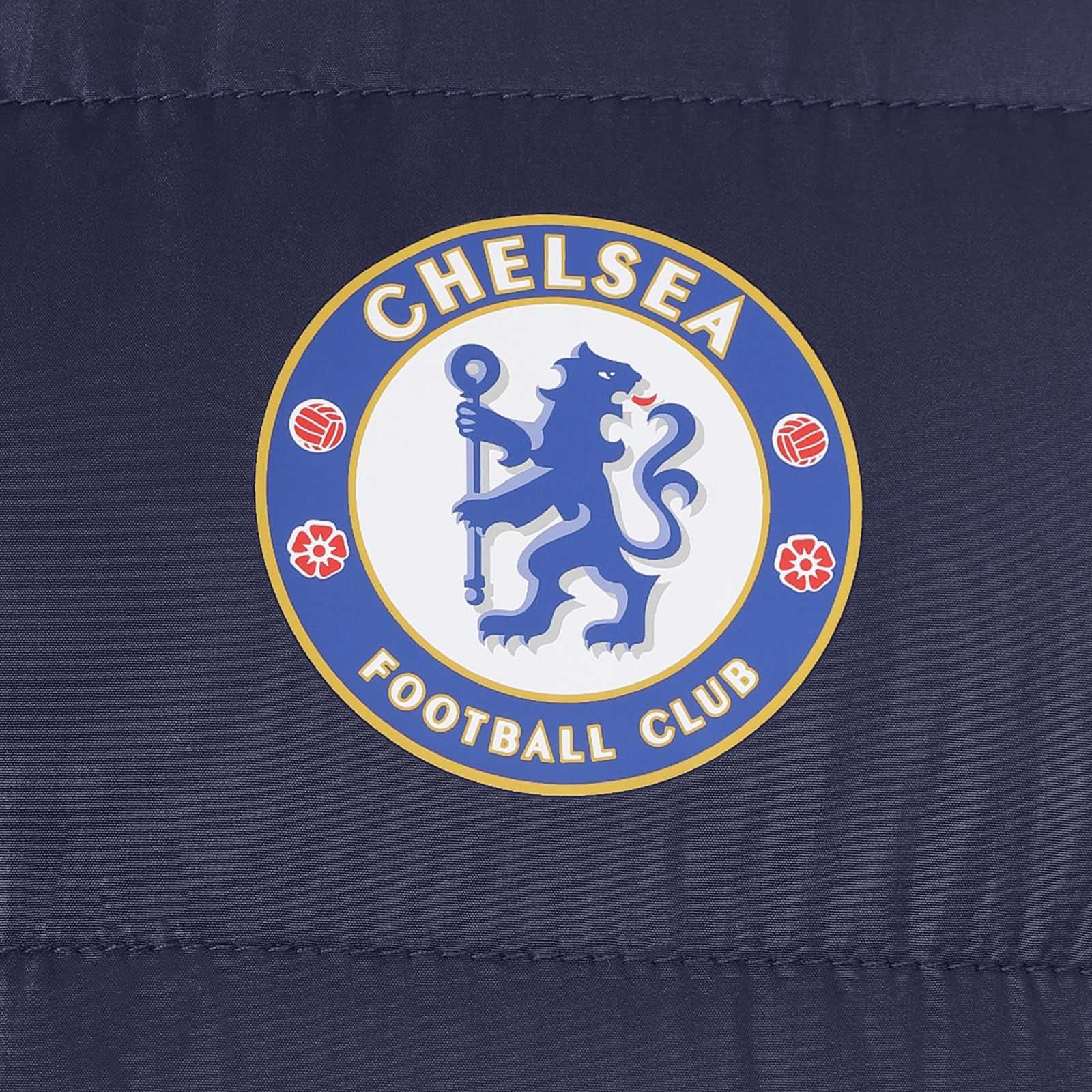 Chelsea kids quilted jacket in blue with club crest to chest.