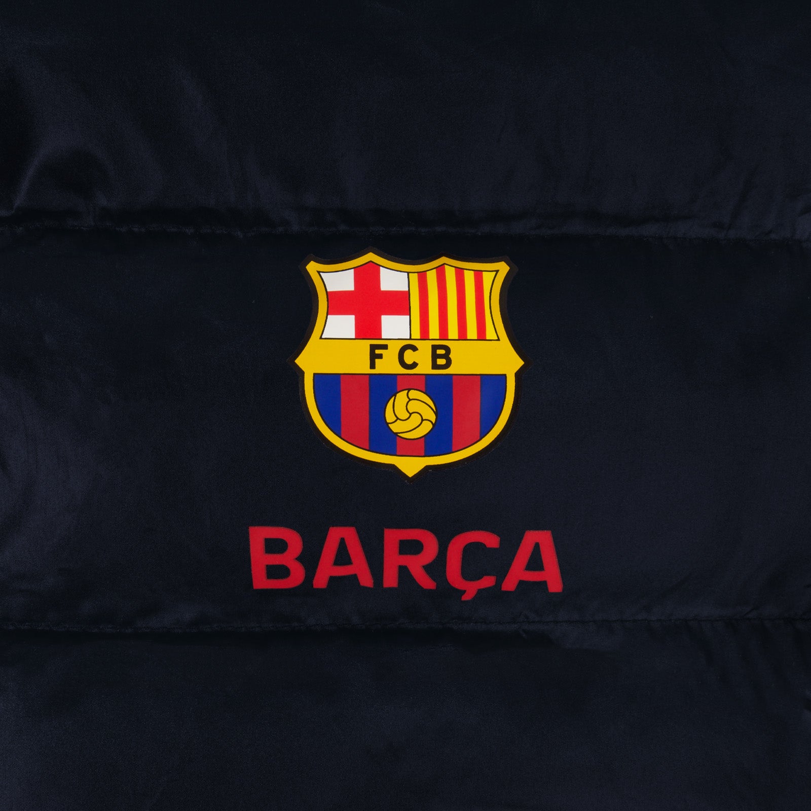 FC Barcelona kids quilted jacket in navy blue with club crest to chest.