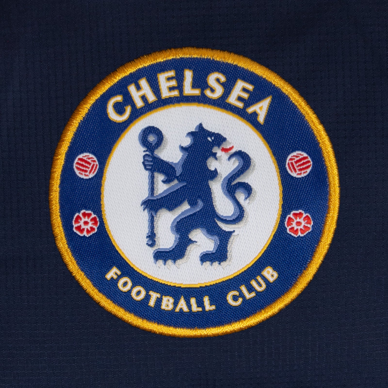 Chelsea kids quilted jacket in navy with club crest to chest.