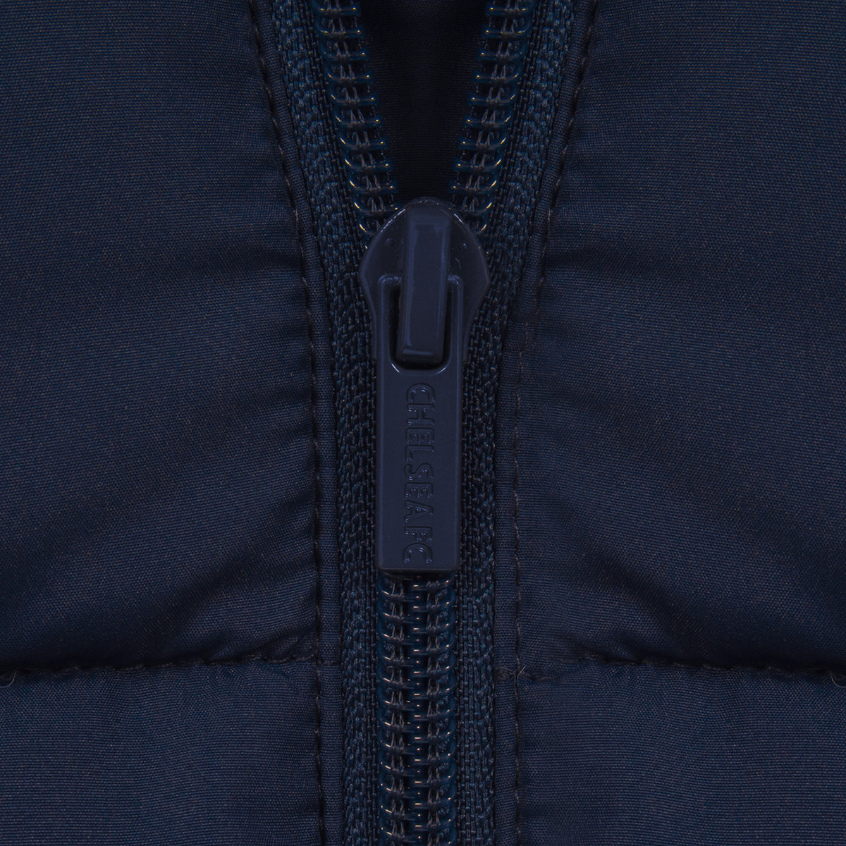 Chelsea kids quilted jacket in navy with club crest to chest.