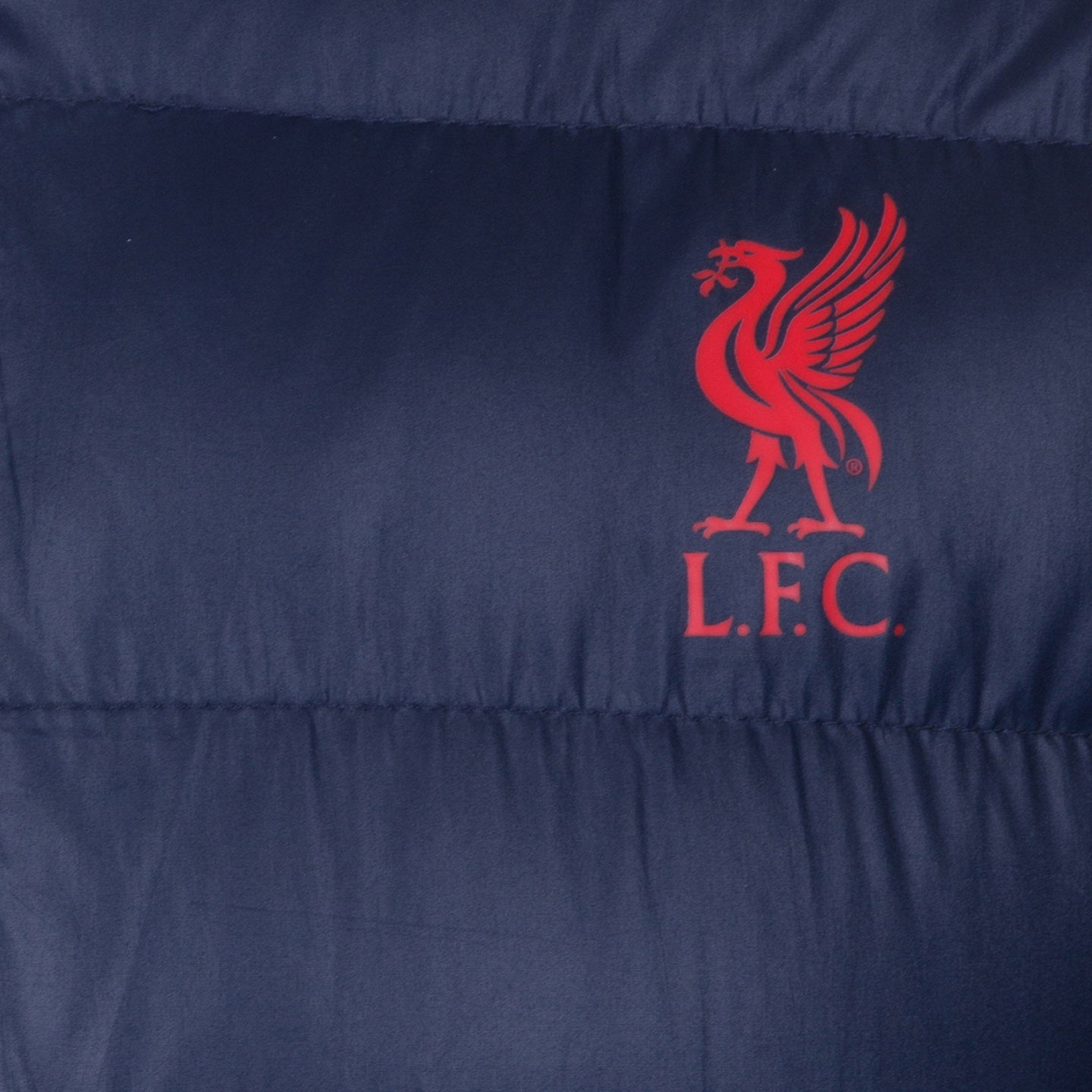 Liverpool adults quilted jacket in navy blue with club crest to chest.