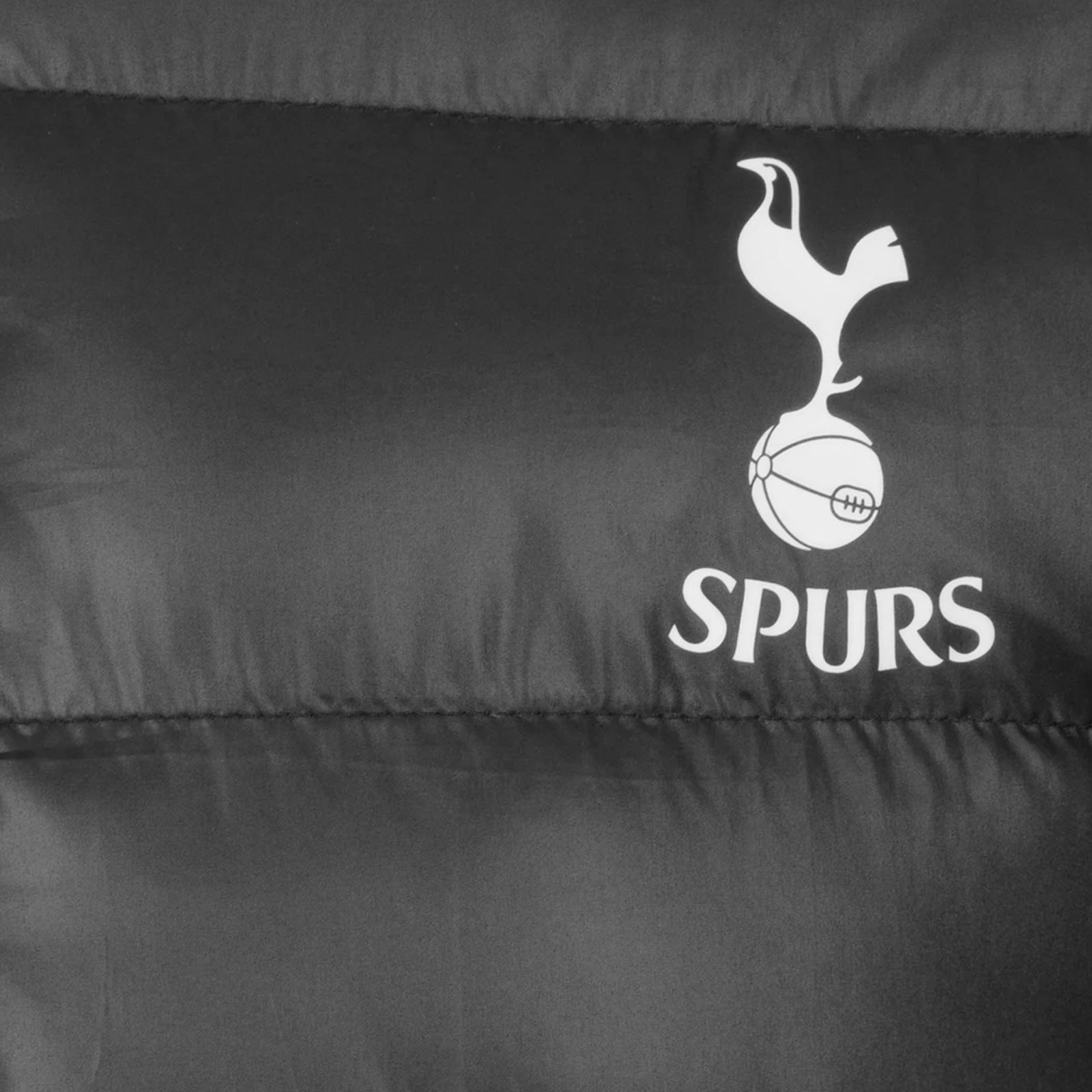 Spurs adults quilted jacket in black with club crest print to chest.