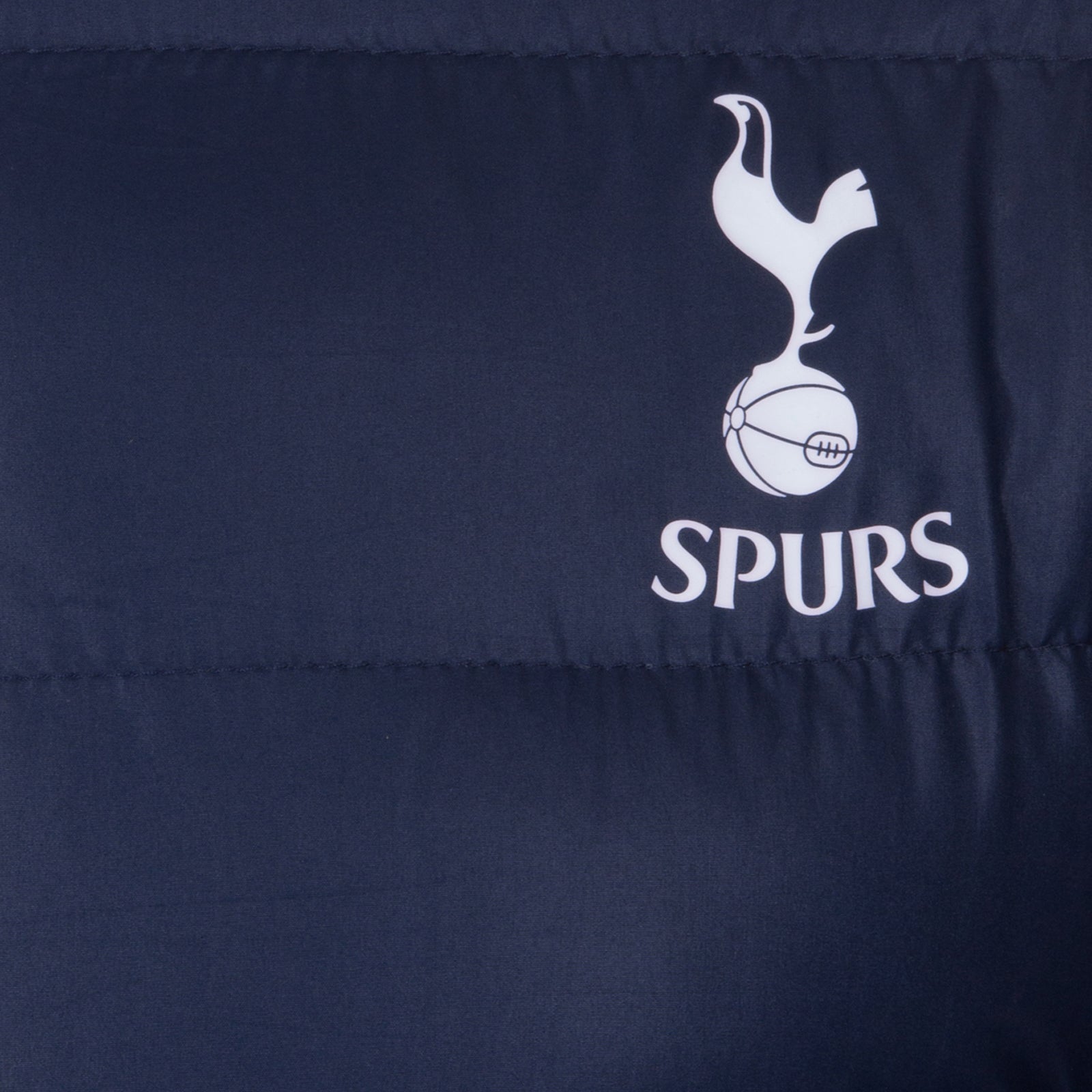 Spurs adults quilted jacket in navy blue with club crest print to chest.