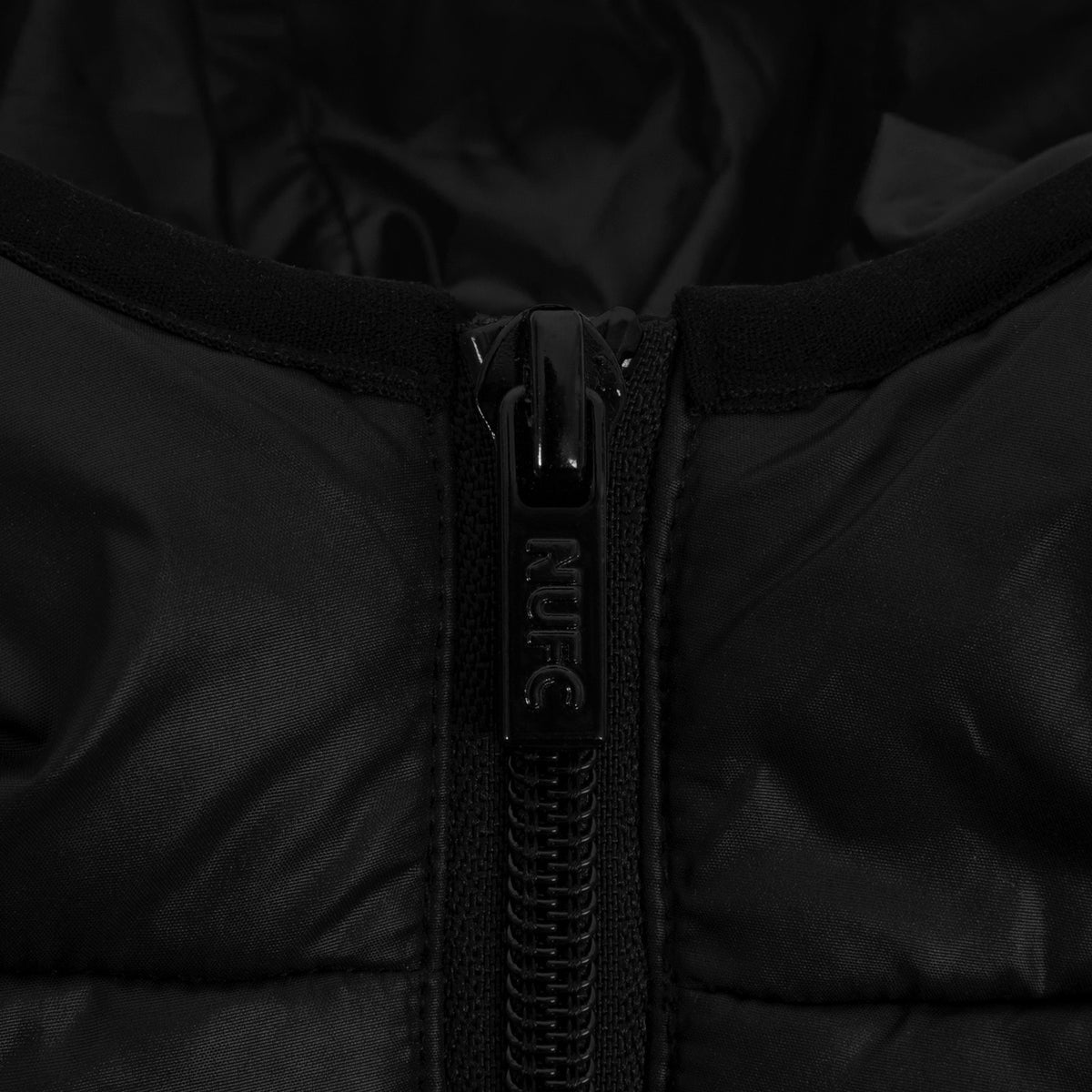 Newcastle United kids quilted jacket in black with club crest to chest.