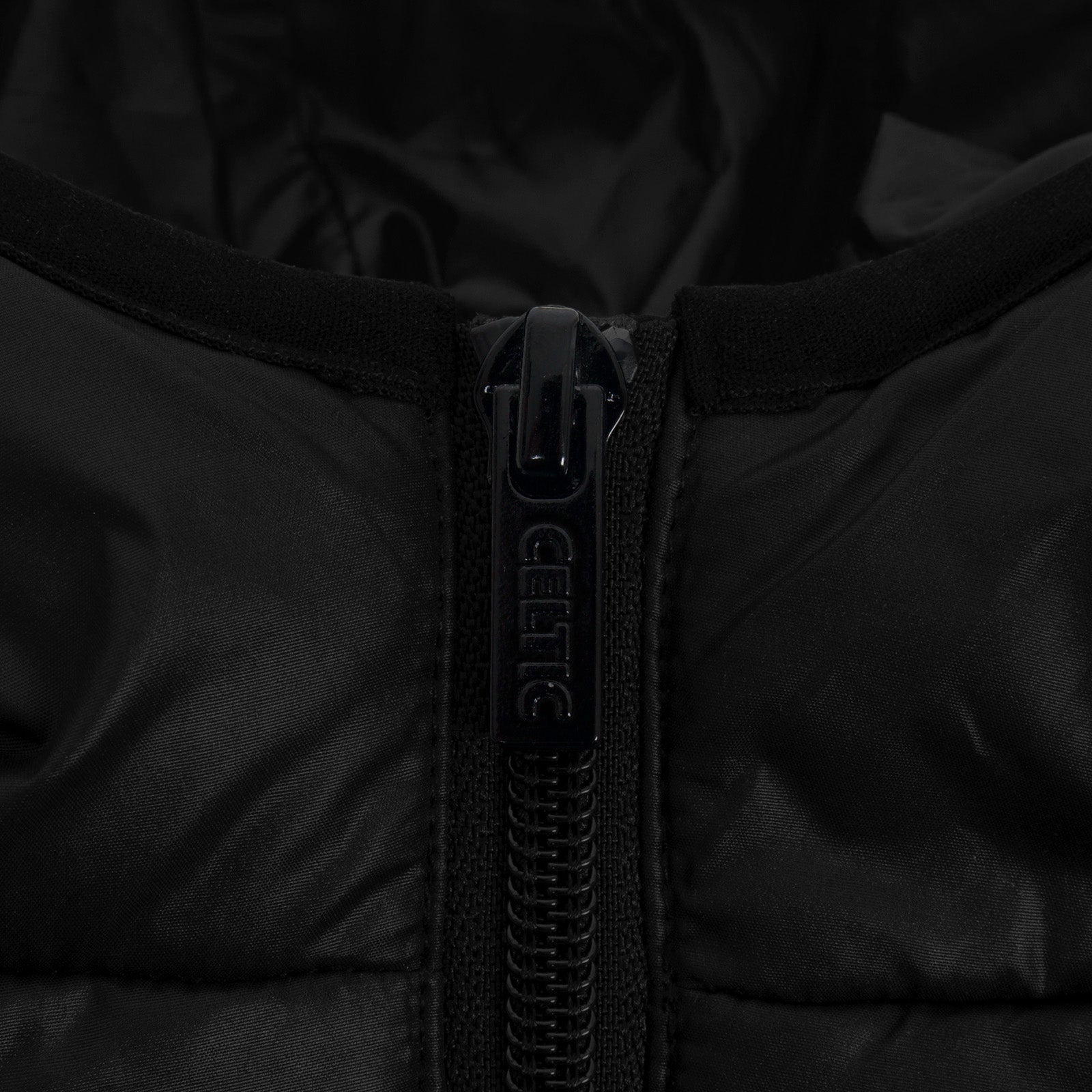 Celtic adults quilted jacket in black with club crest to the left of the chest.