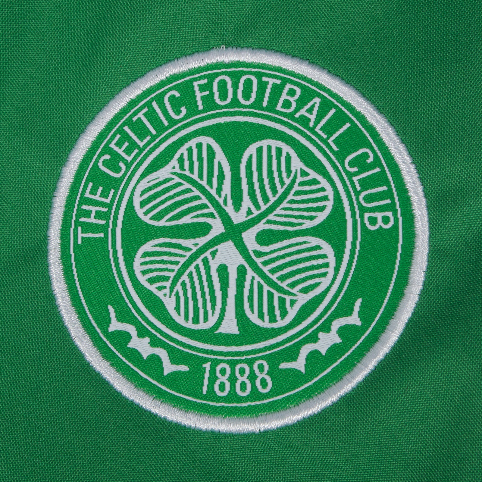 Celtic half zip kids shower jacket in black with club crest to front.