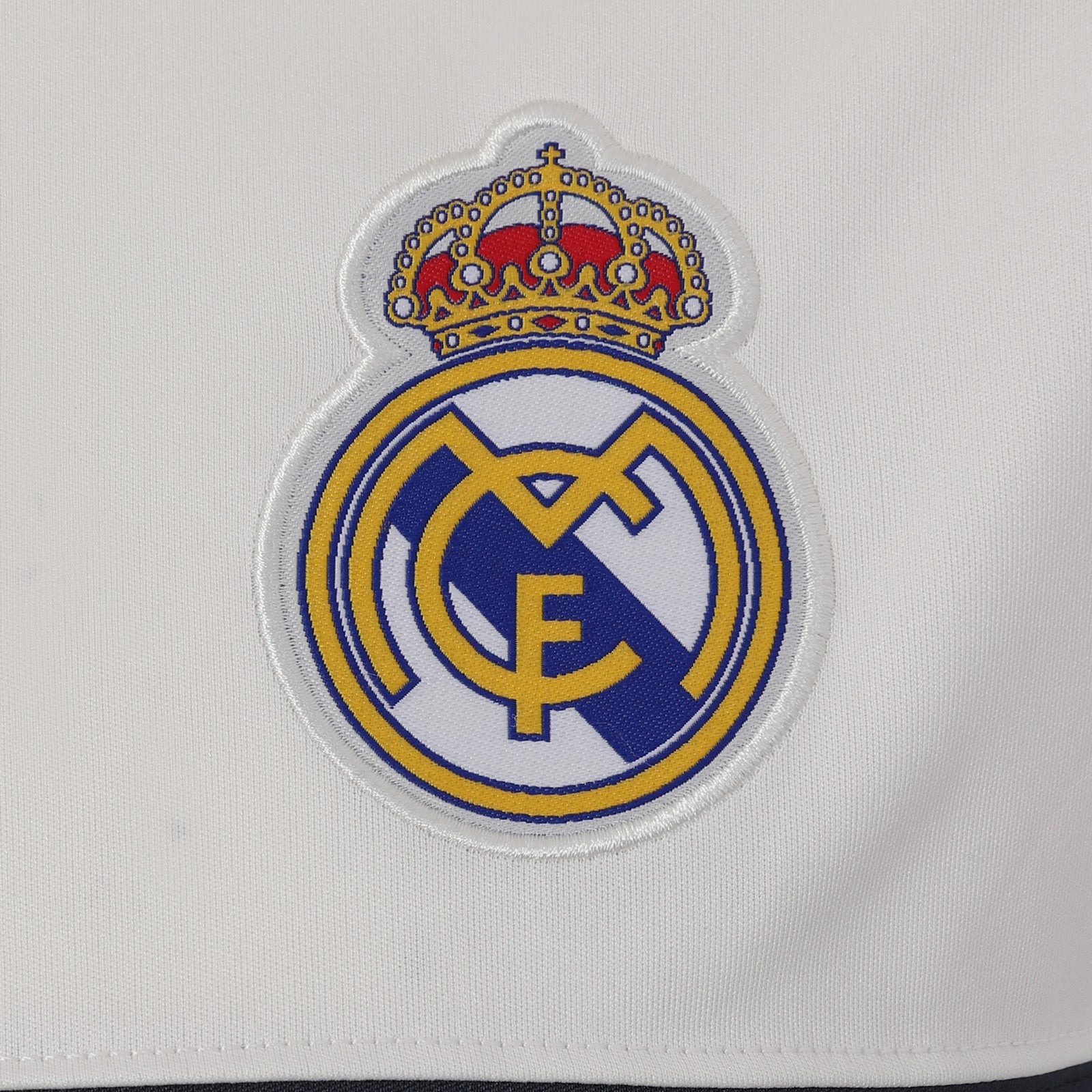 Real Madrid adults T-shirt in white & black stripe with woven club crest to chest