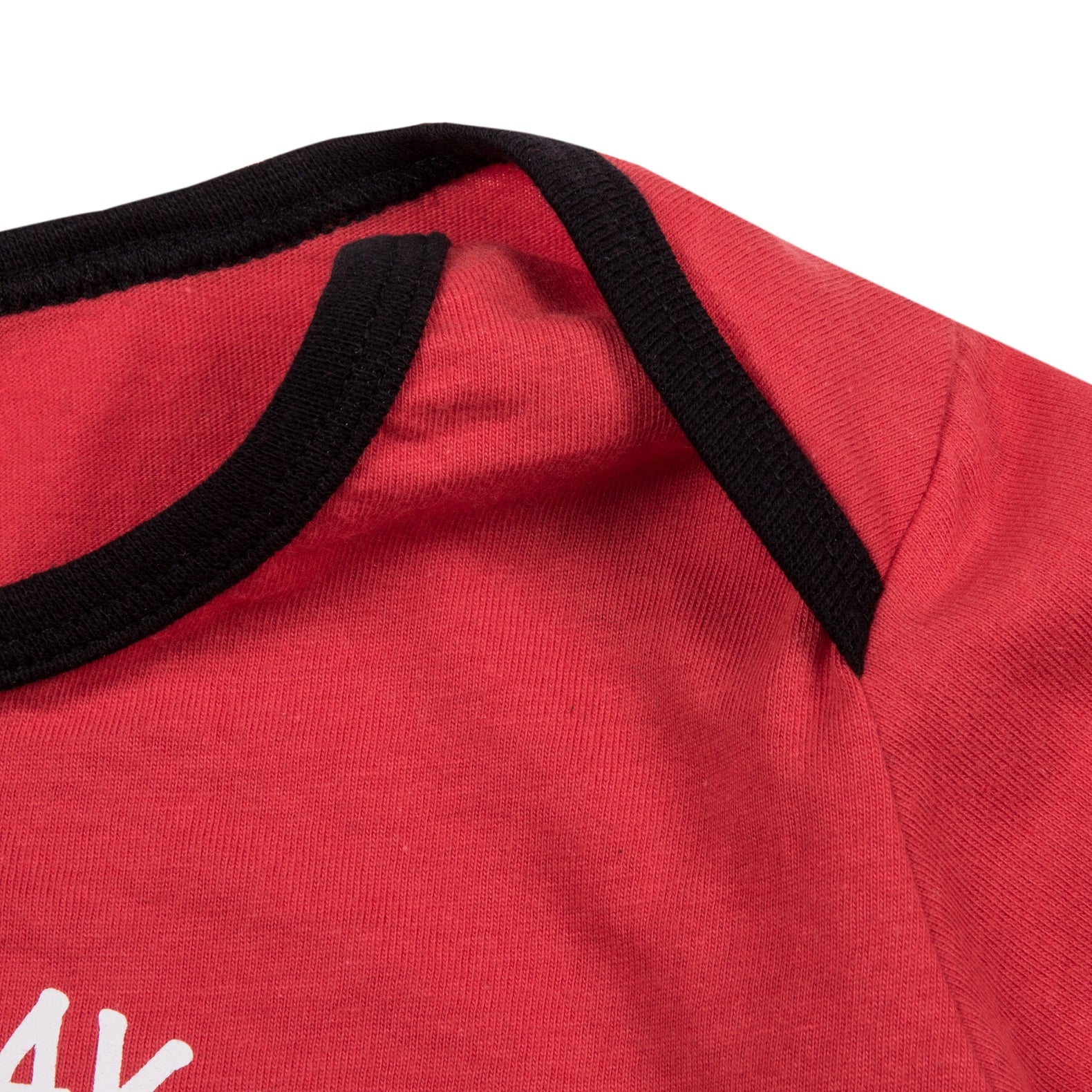 Liverpool baby pyjamas. Long sleeve top in red with crest & text print. Red bottoms with all over club crest