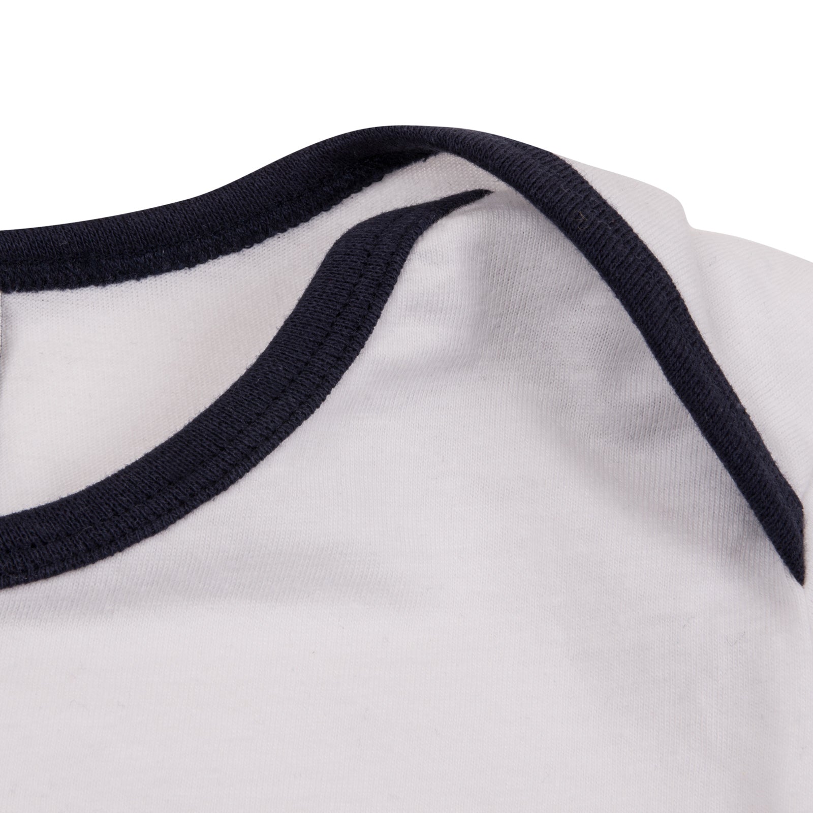 Spurs baby pyjamas with white top and navy bottoms