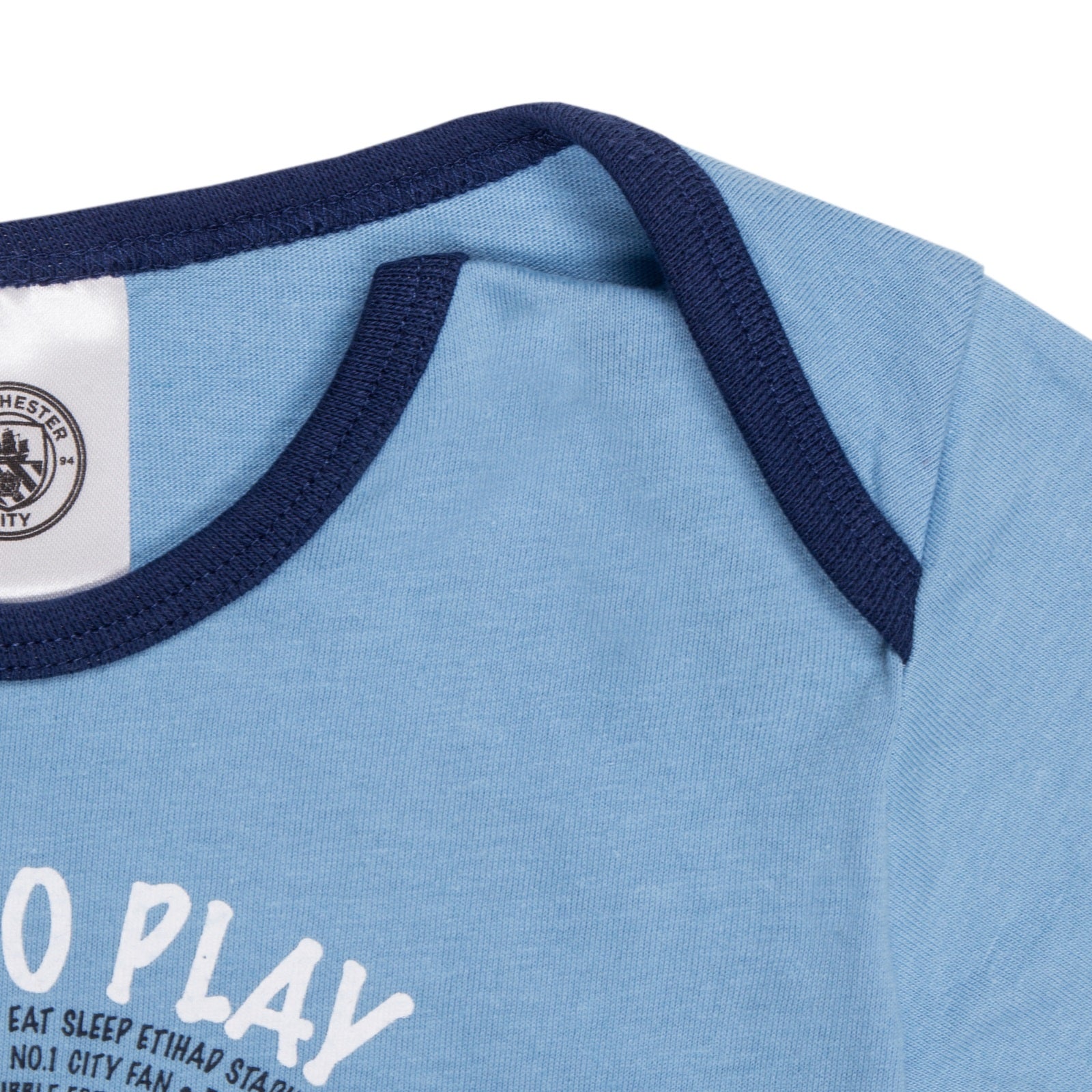 Man City baby pyjamas in sky blue. Long sleeve top with club crest & text print. Matching bottoms with all over crest print