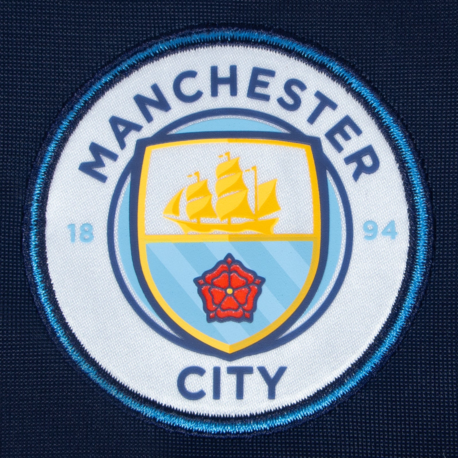 Man City kids retro track jacket in navy blue with club crest to chest.