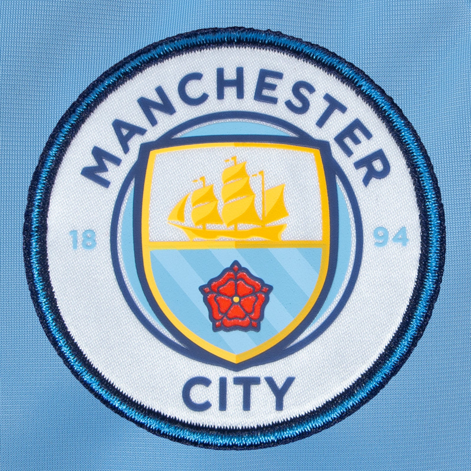 Man City kids retro track jacket in sky blue with club crest to chest.