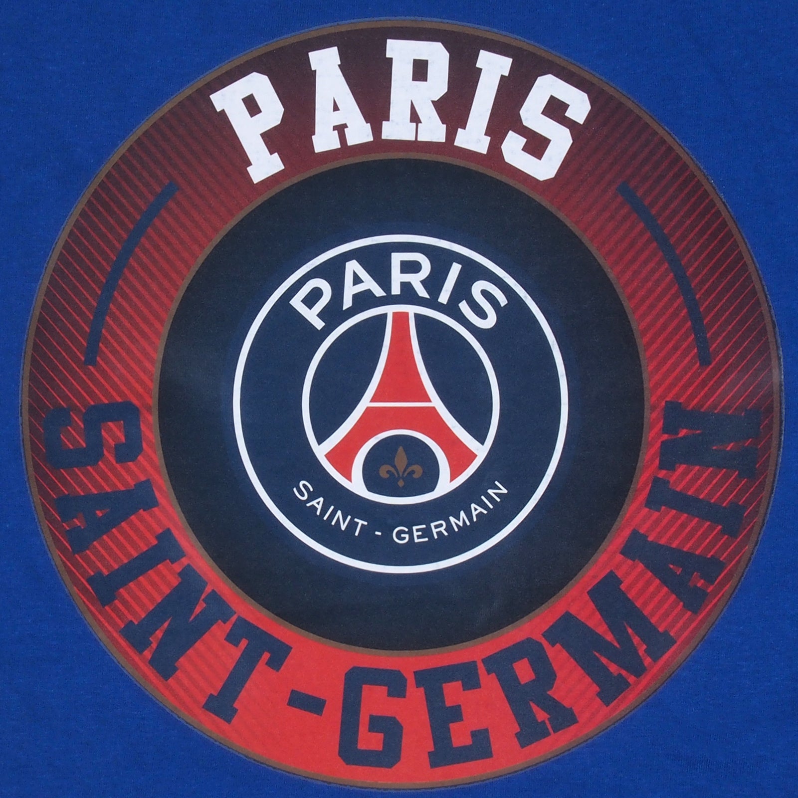 PSG kids long pyjamas in blue iwith long sleeve top with graphic crest with long legged bottoms