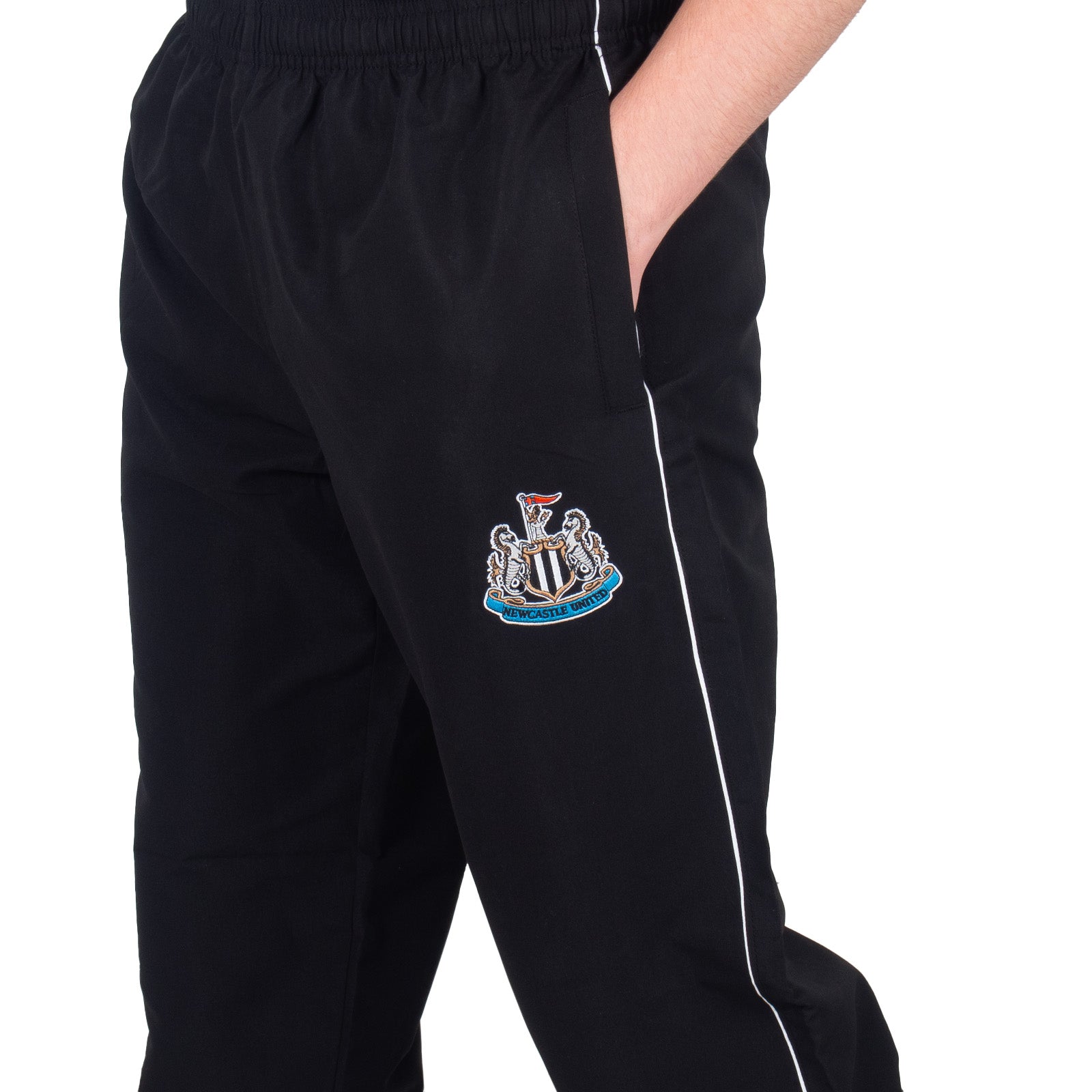 Newcastle Utd adults tracksuit in black with club crest to chest and left thigh