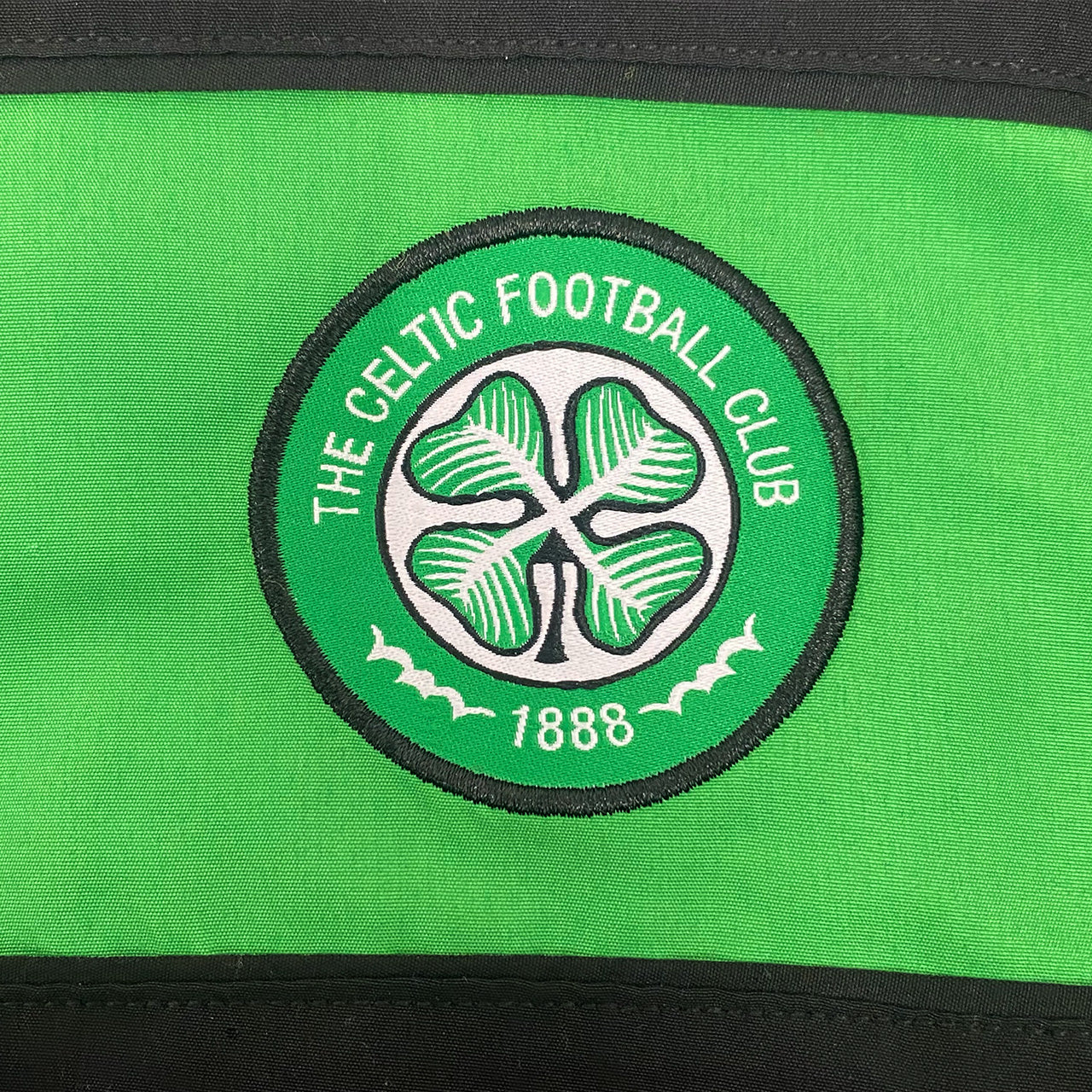 Celtic kids tracksuit in black with club crest to chest and left thigh