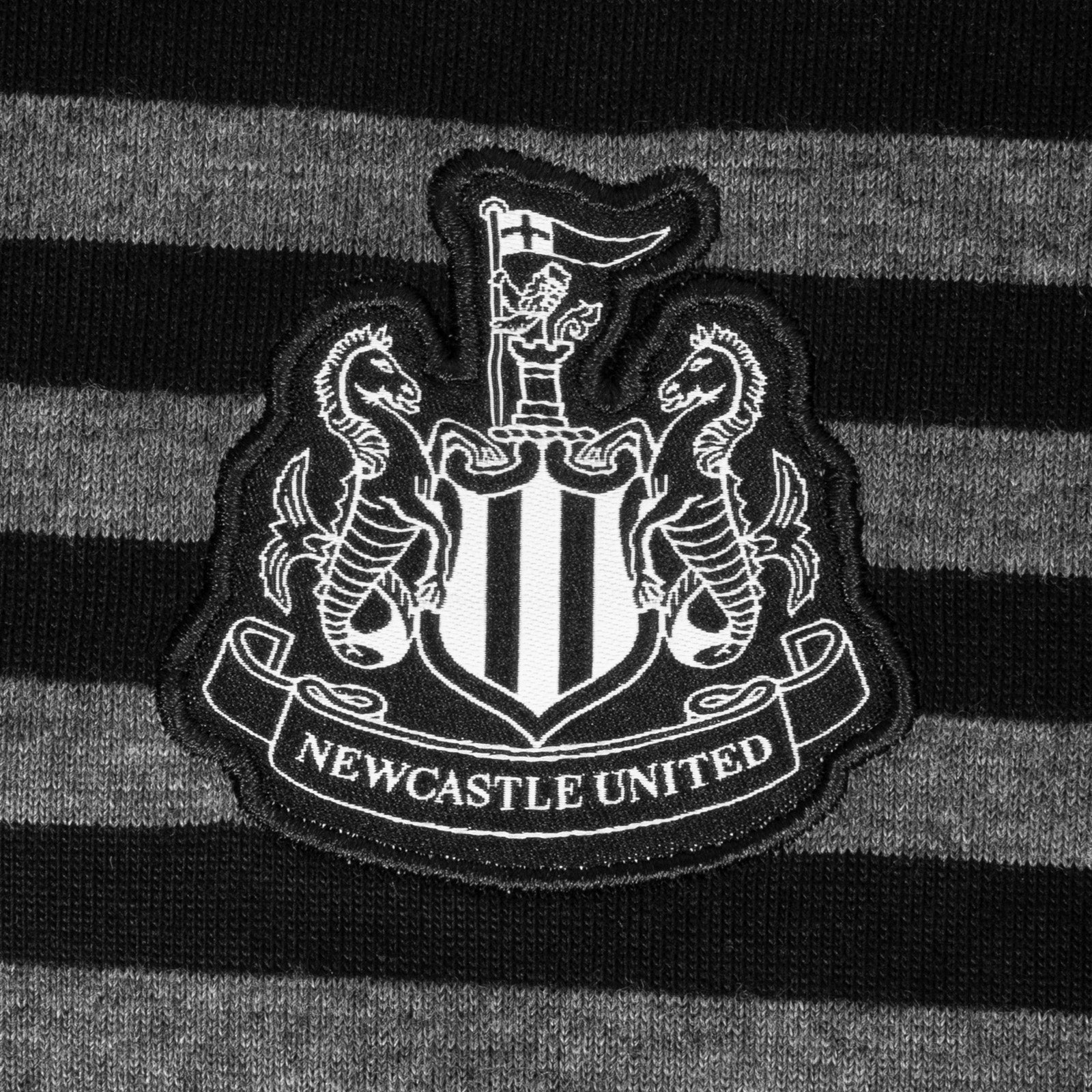 Newcastle Utd adults striped polo shirt in black & grey with club crest to chest.