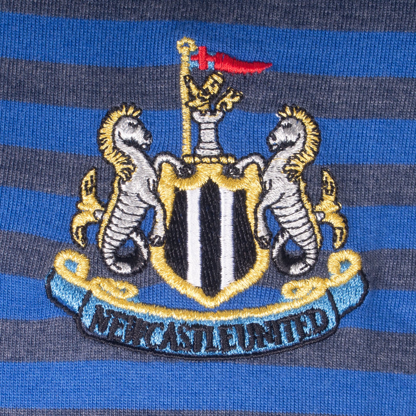 Newcastle Utd adults striped polo shirt in blue with club crest to chest.