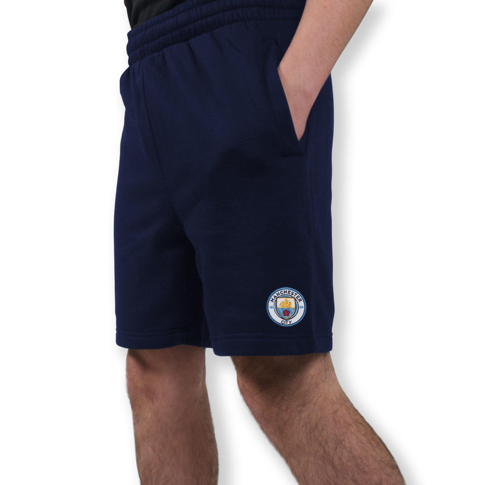 Man City adults fleece shorts in navy blue with crest to left leg and pockets to front & back.