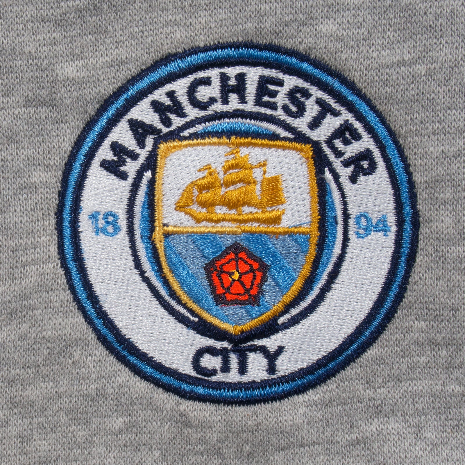 Man City adults fleece shorts in grey with crest to left leg and pockets to front & back.
