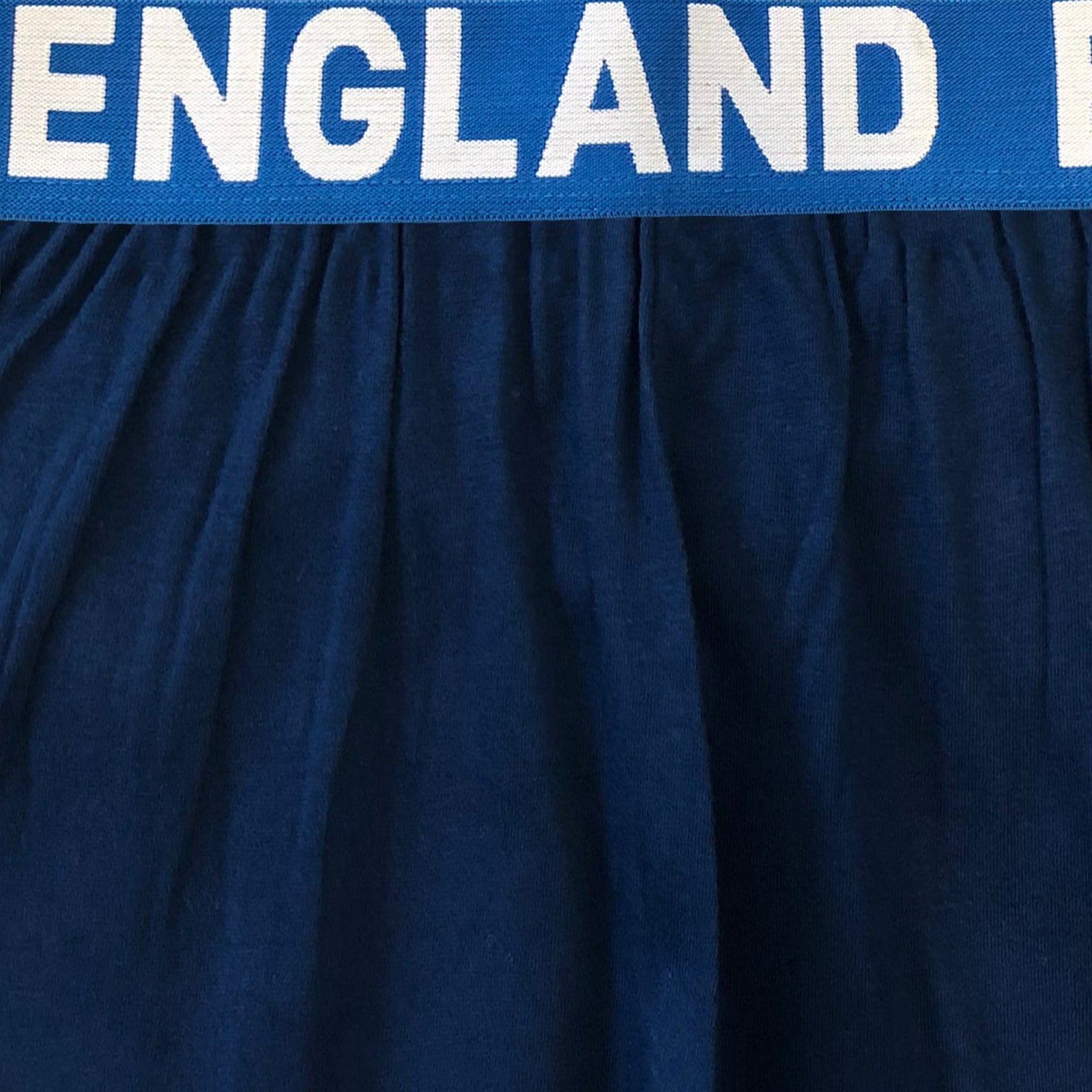 England kids pyjamas in white. Short sleeve top with graphic and shorts with 3 Lions logo to the left leg.