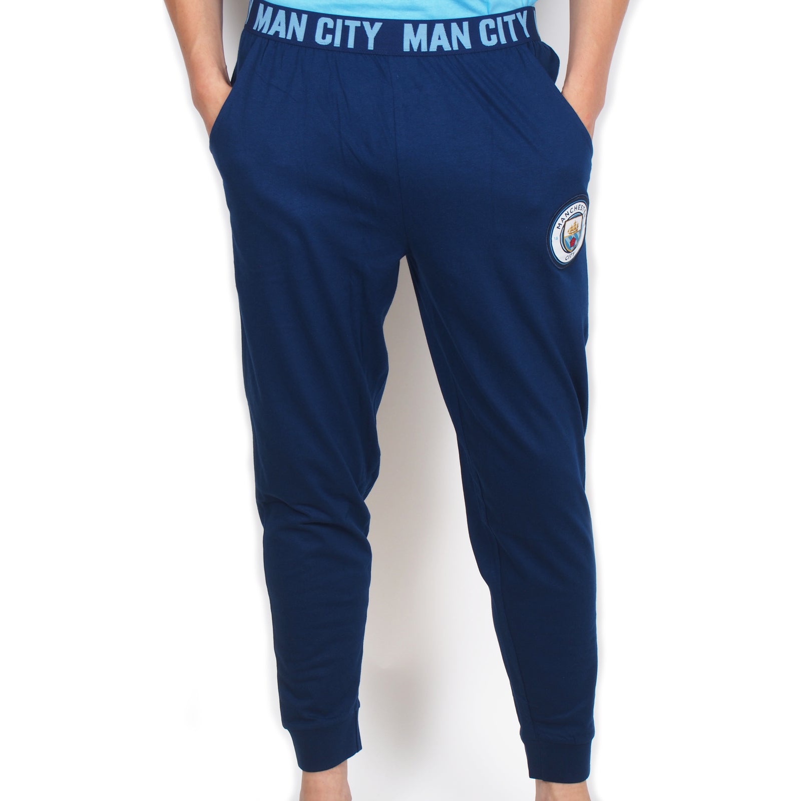 Man City adults long pyjamas in navy blue. Two-tone short sleeve top with crest and long bottoms with badge