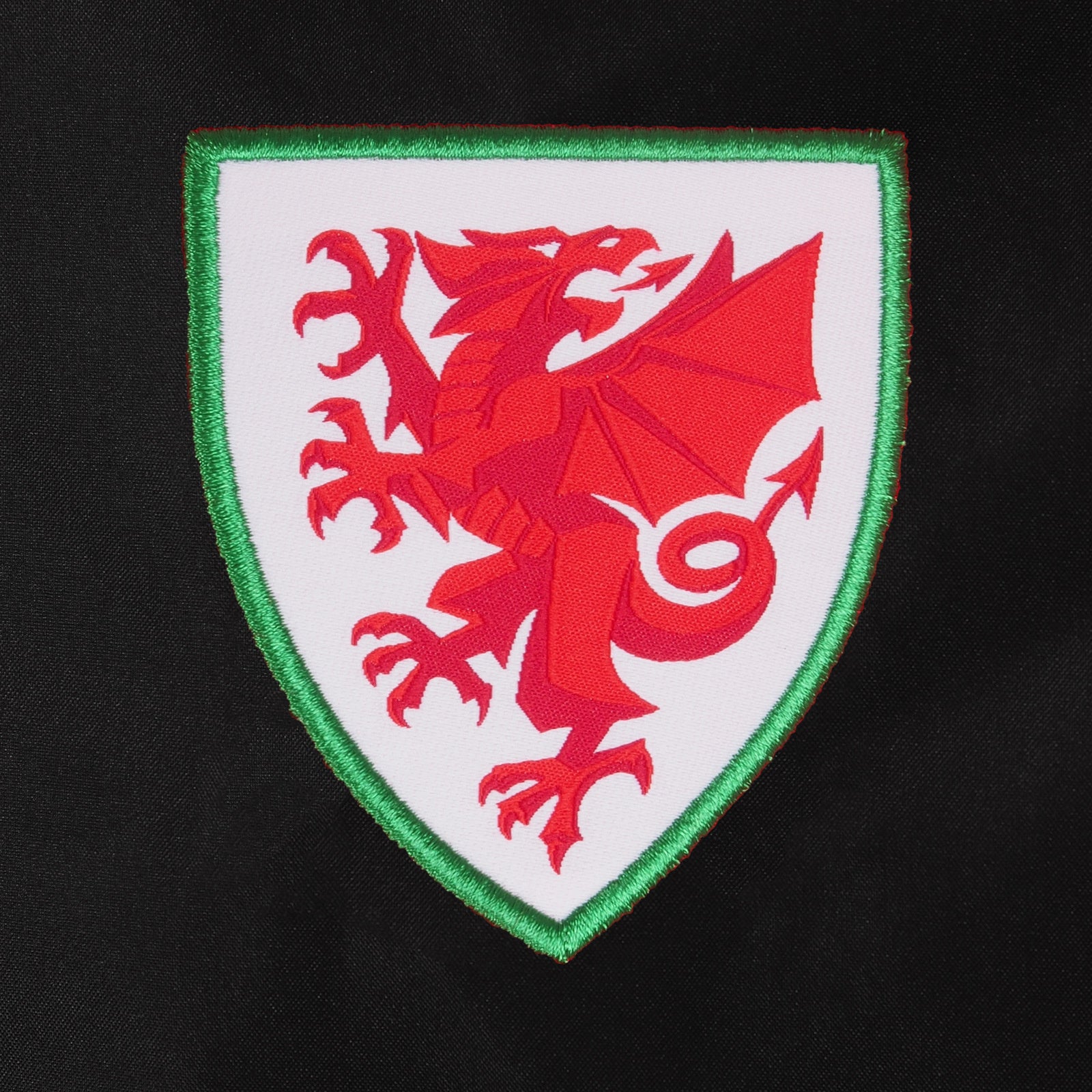 Wales adults shower jacket in black with Wales FA club badge to the left chest.