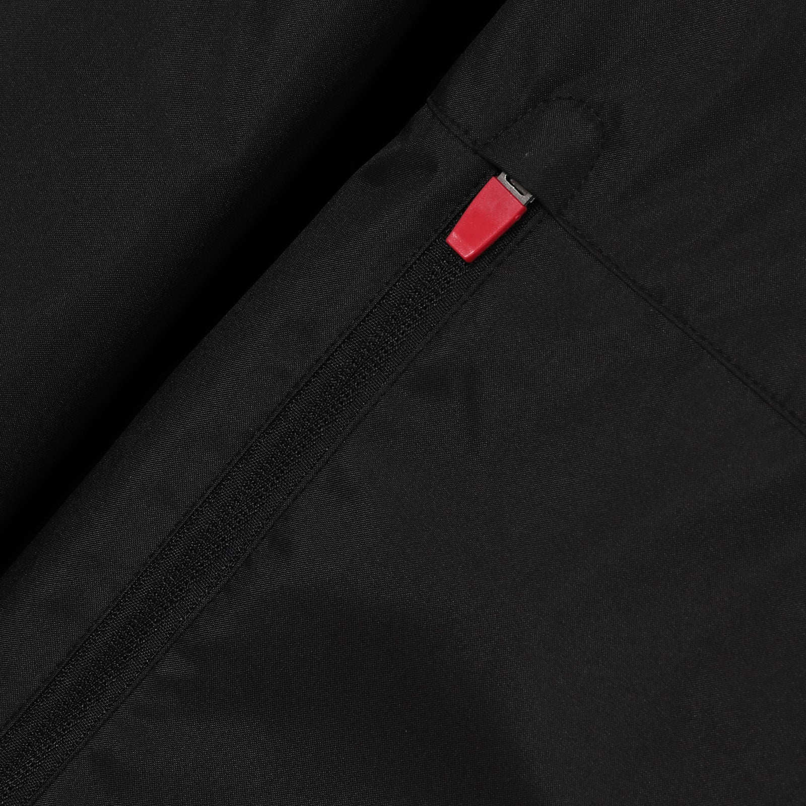 Wales adults shower jacket in black with Wales FA club badge to the left chest.
