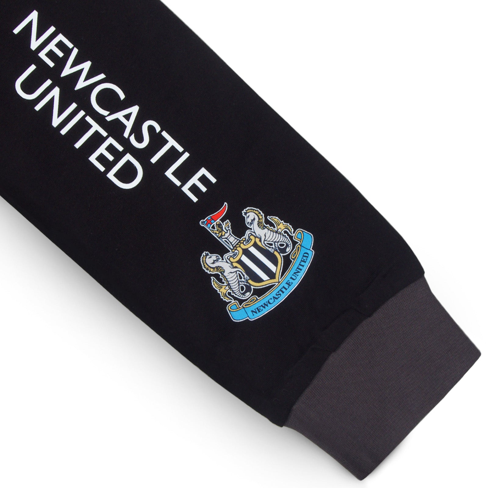 Newcastle Utd kids long pyjamas in black with long sleeve top with graphic crest with long legged bottoms