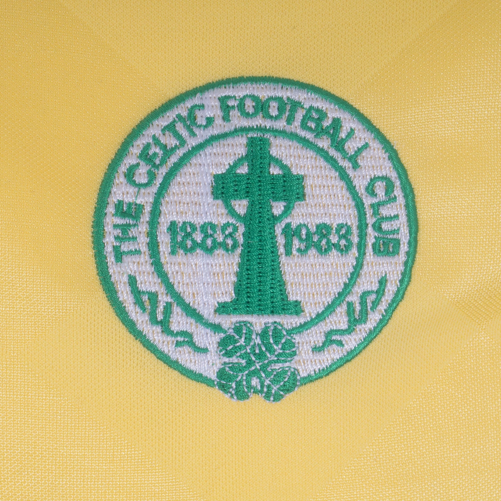 Celtic retro football shirt. Replica 1988 shirt in yellow with club crest and sponsor print to front