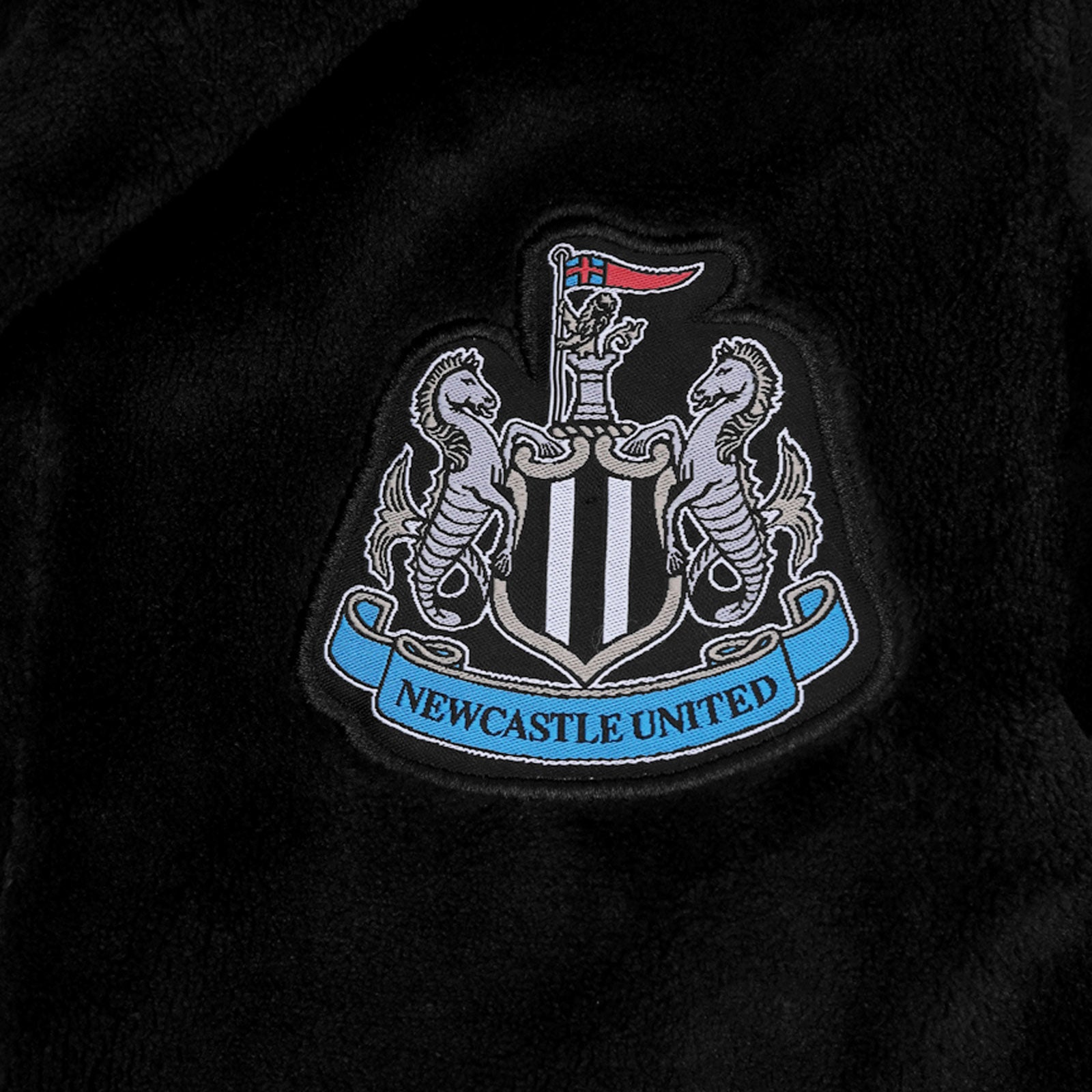 Newcastle United baby hooded dressing gown in black with crest