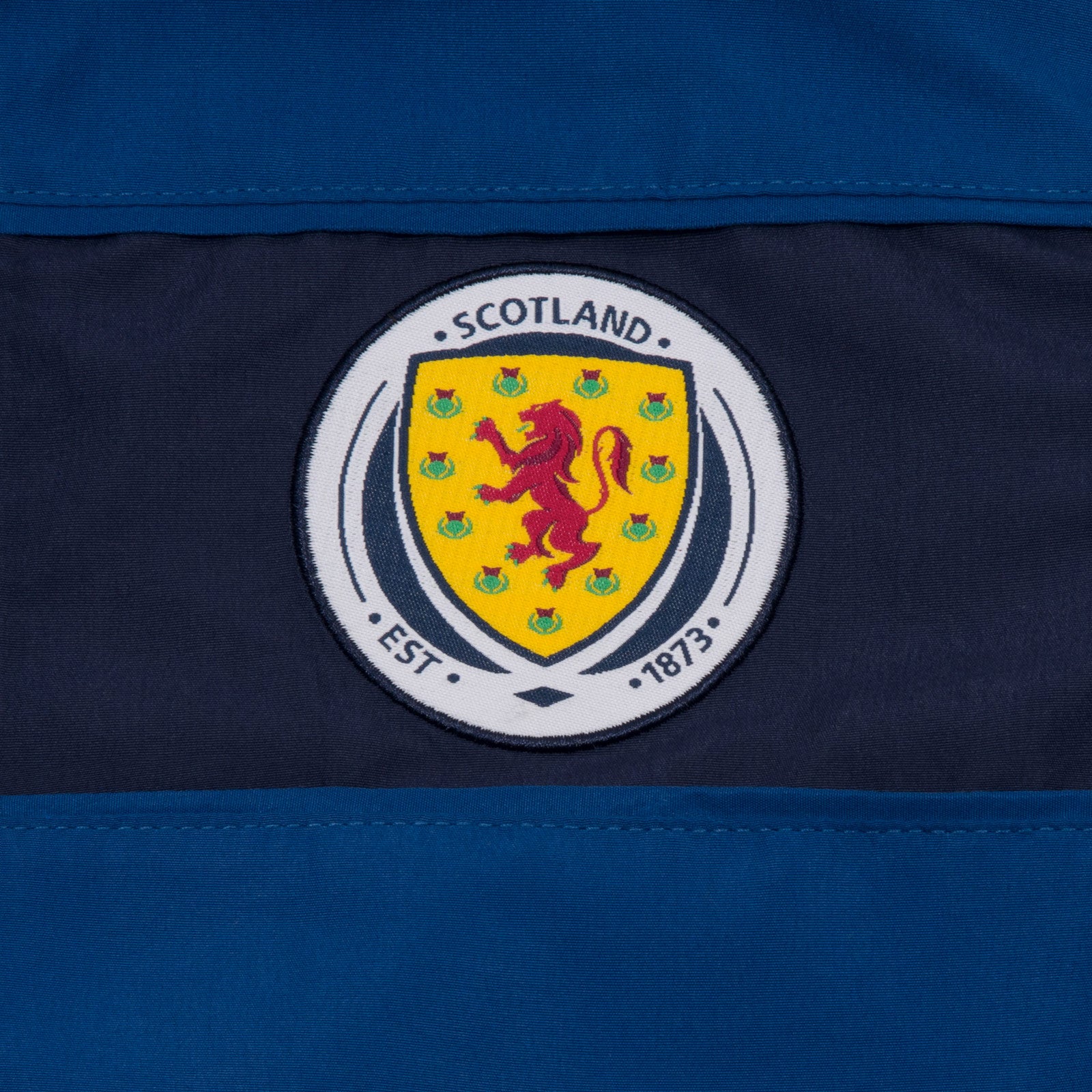 Scotland FA kids tracksuit in navy blue with national crest to chest and left thigh
