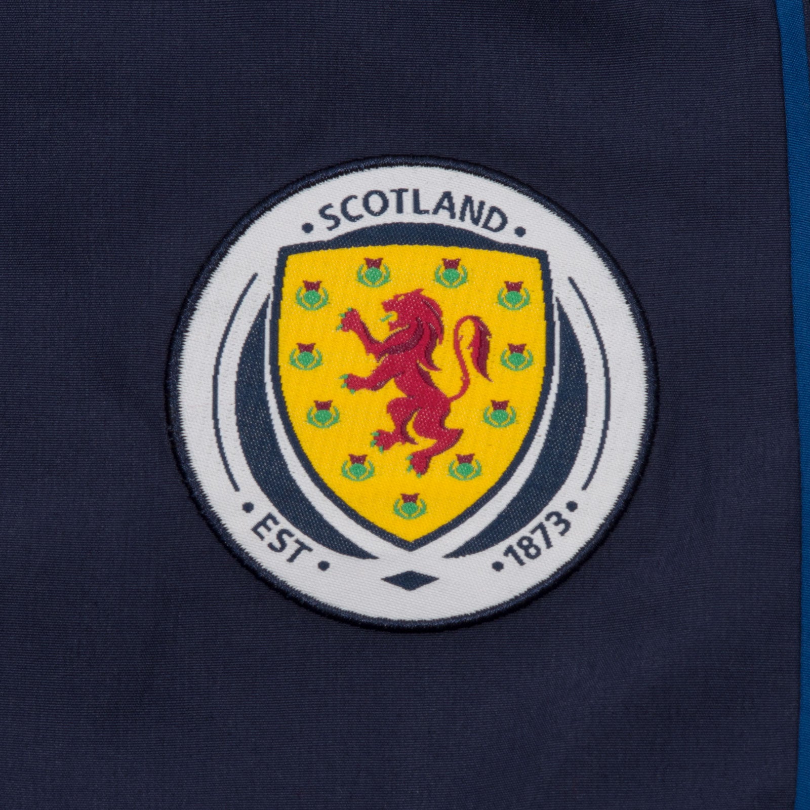 Scotland FA kids tracksuit in navy blue with national crest to chest and left thigh