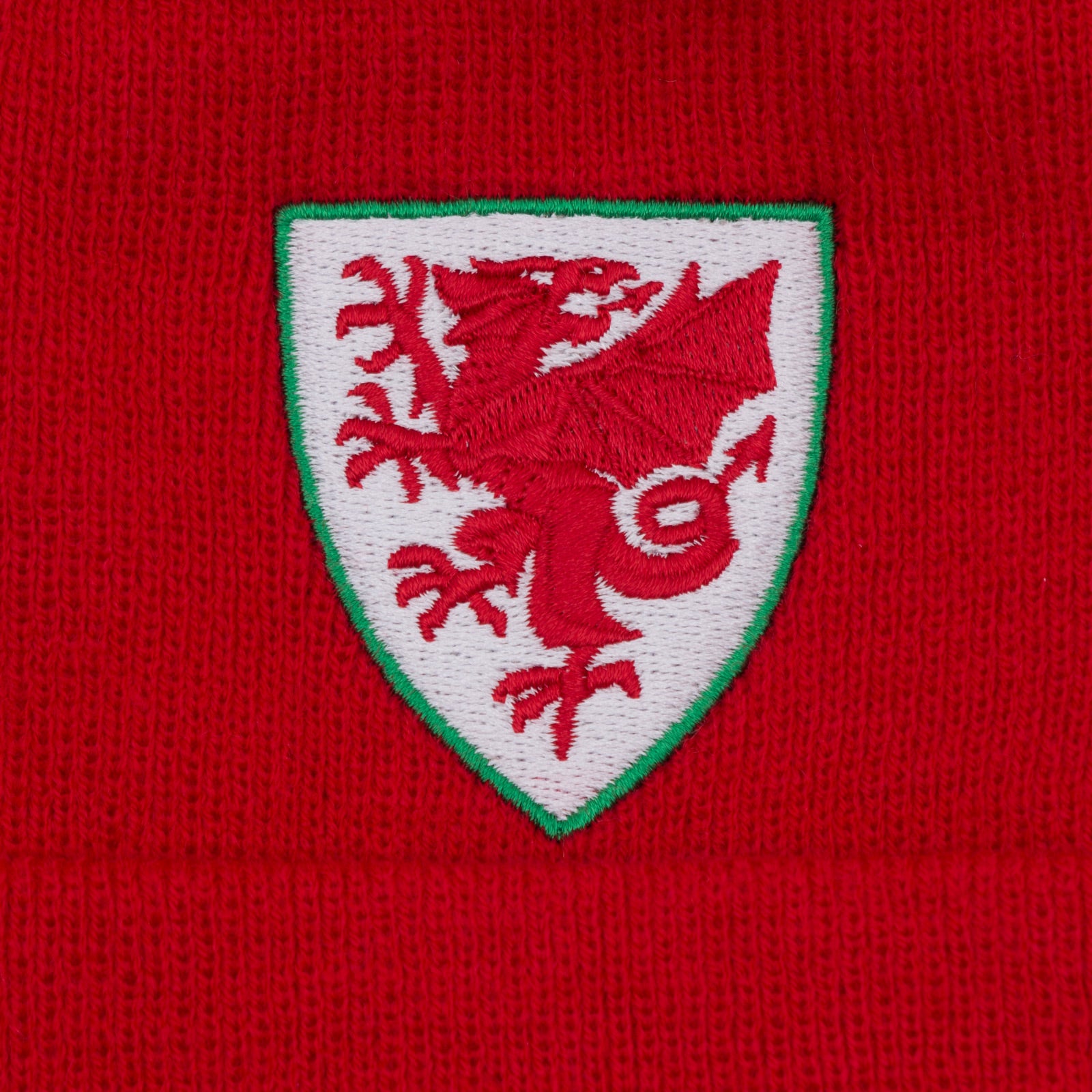 Wales bar scarf & bobble hat in red, yellow & green with Wales crest to hat & to end of the scarf.