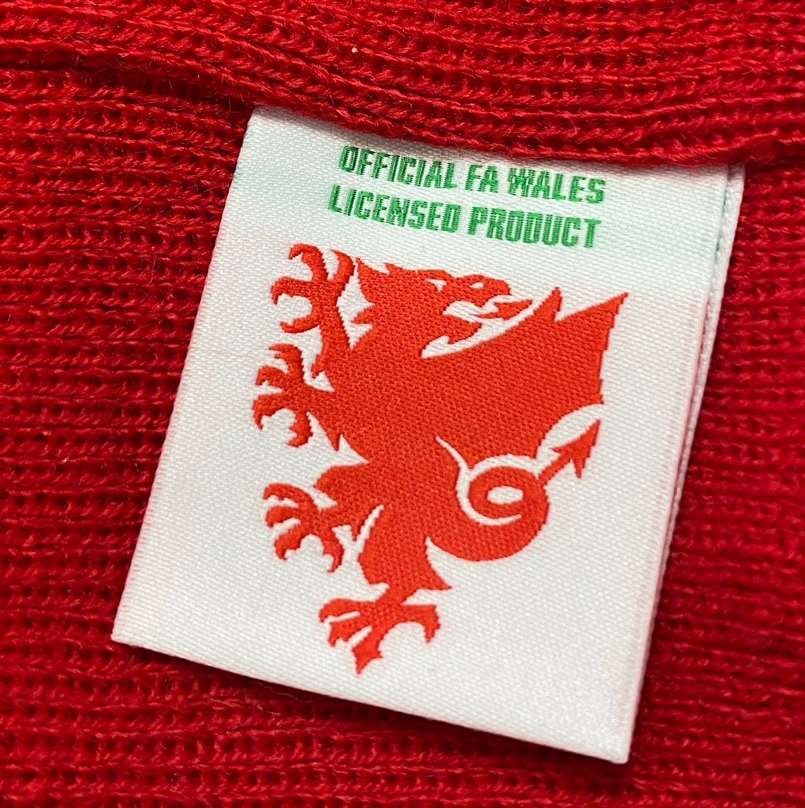 Wales bar scarf & bobble hat in red, yellow & green with Wales crest to hat & to end of the scarf.