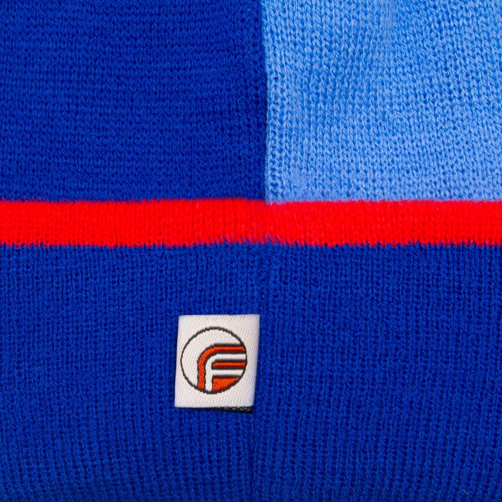 Arsenal retro knitted bobble hat in blue with text to front