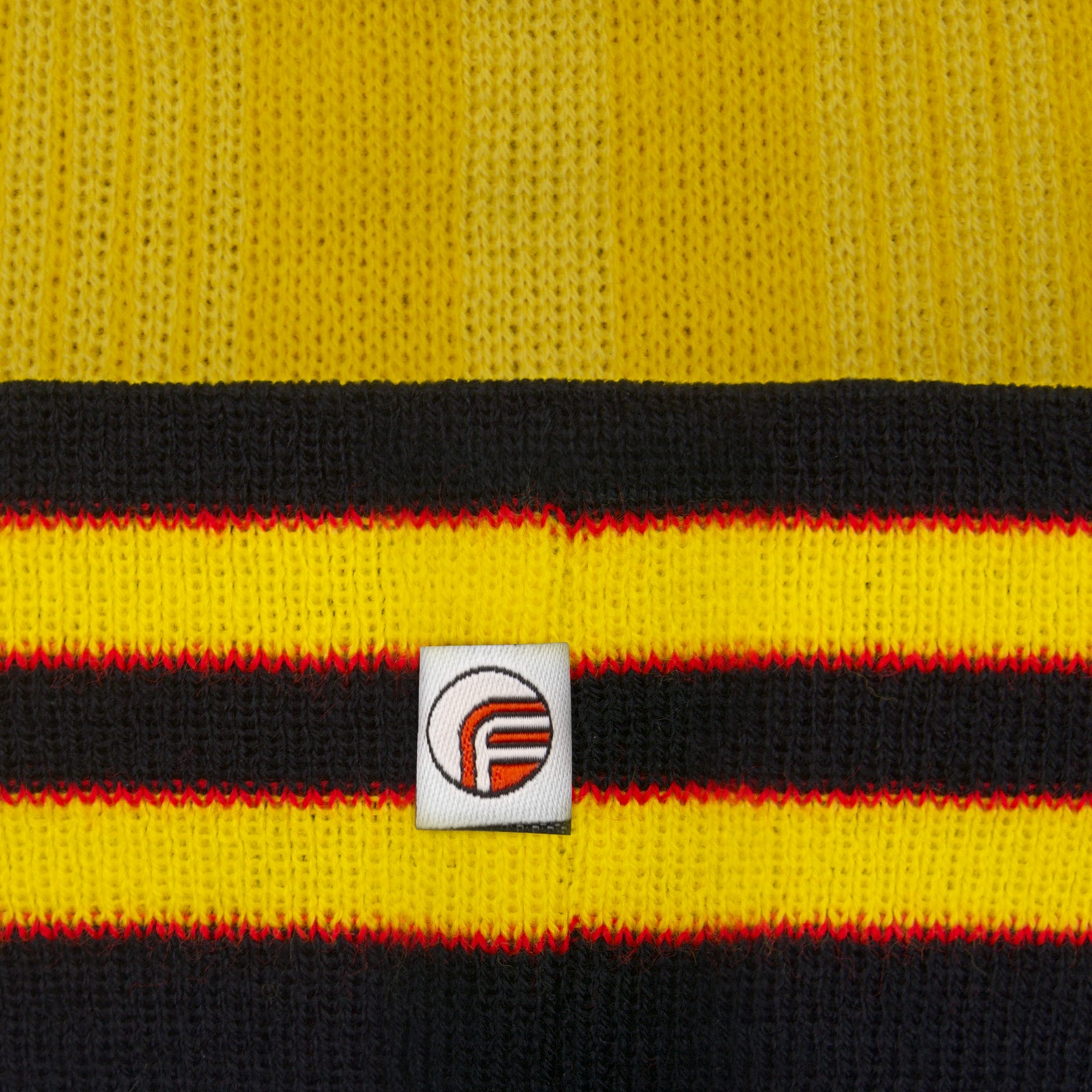 Arsenal retro knitted bobble hat in yellow with text to front