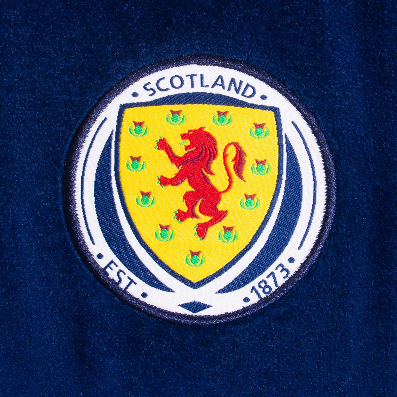 Scotland kids all-in-one hooded fleece with all over print team crest.
