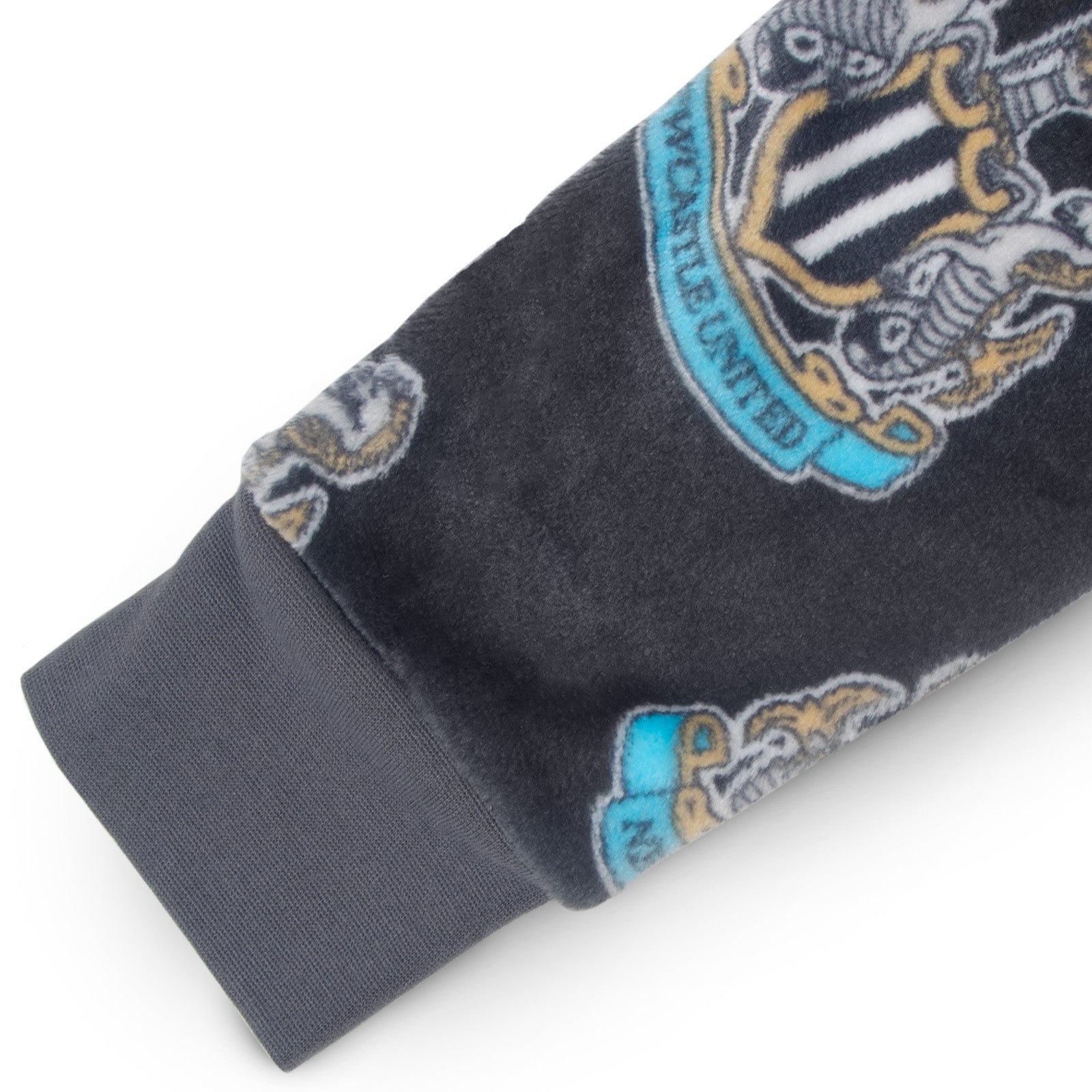 Newcastle United kids all-in-one hooded fleece with all over print team crest.