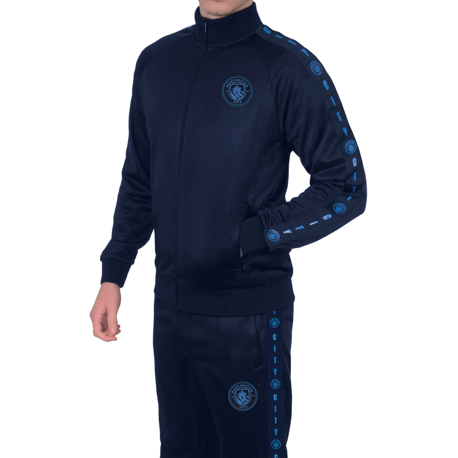 Manchester City adults taped tracksuit in navy blue with club crest and text to both top & pants