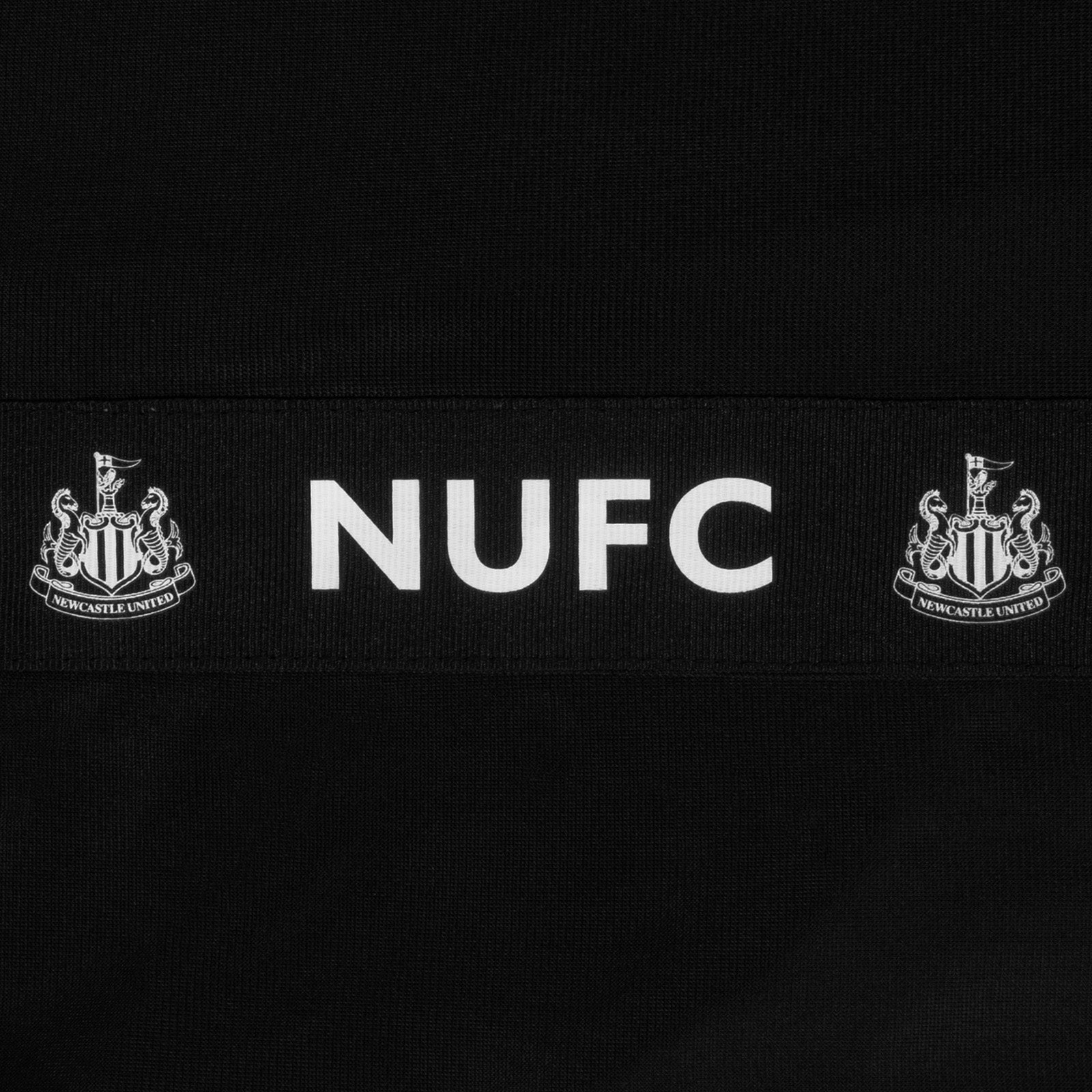 Newcastle United adults taped tracksuit in black with club crest and text to both top & pants
