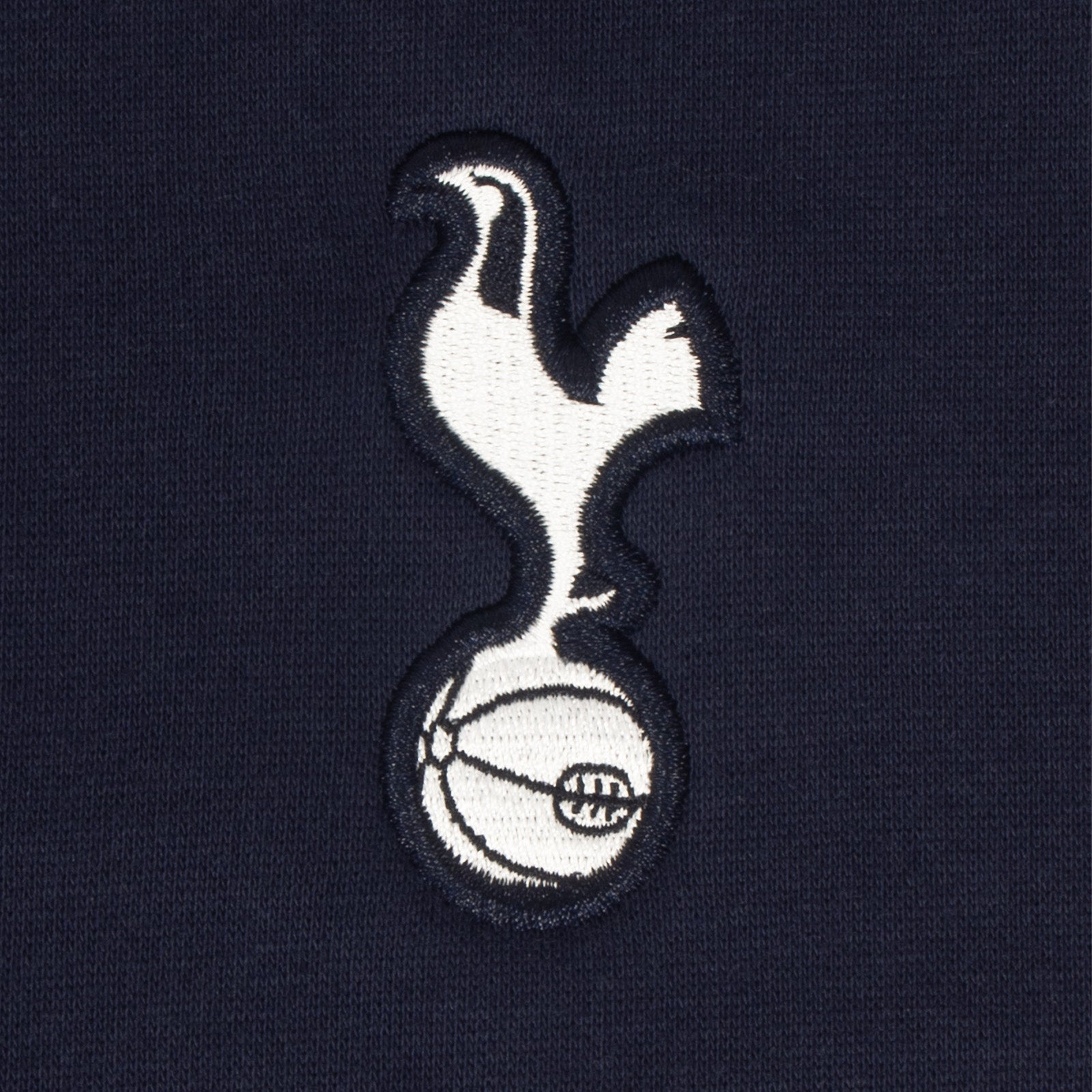 Tottenham Hotspur adults taped sweatshirt in navy blue with club crest to chest and text to sleeves.