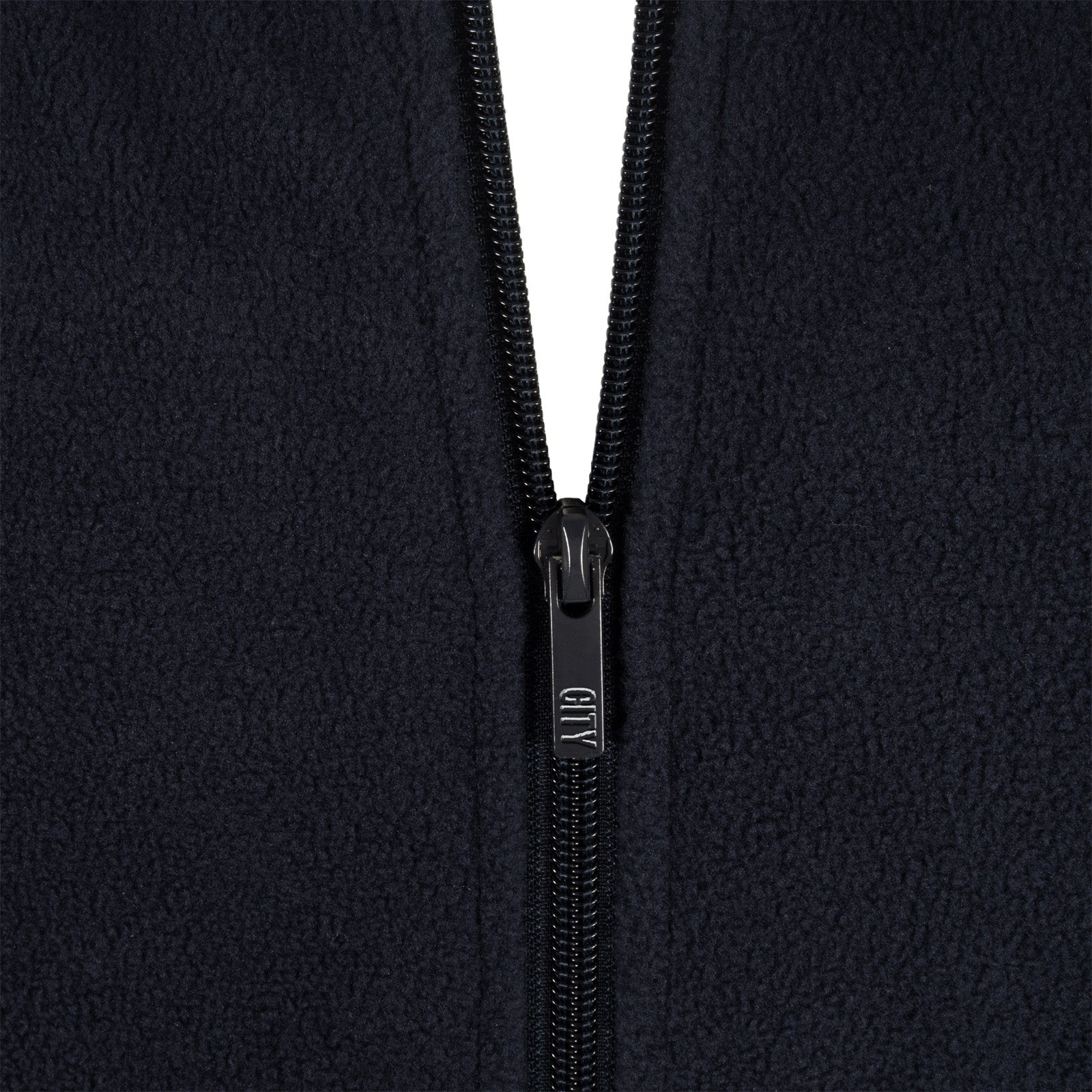 Manchester City adults microfleece jacket in navy with a woven club crest to chest.