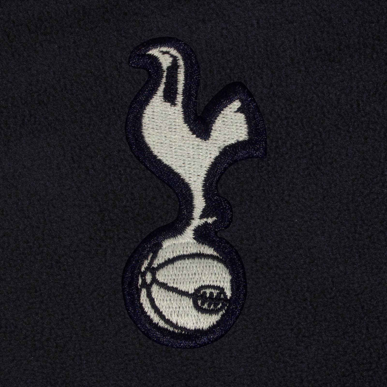 Tottenham Hotspur adults microfleece jacket in navy with a woven club crest to chest.