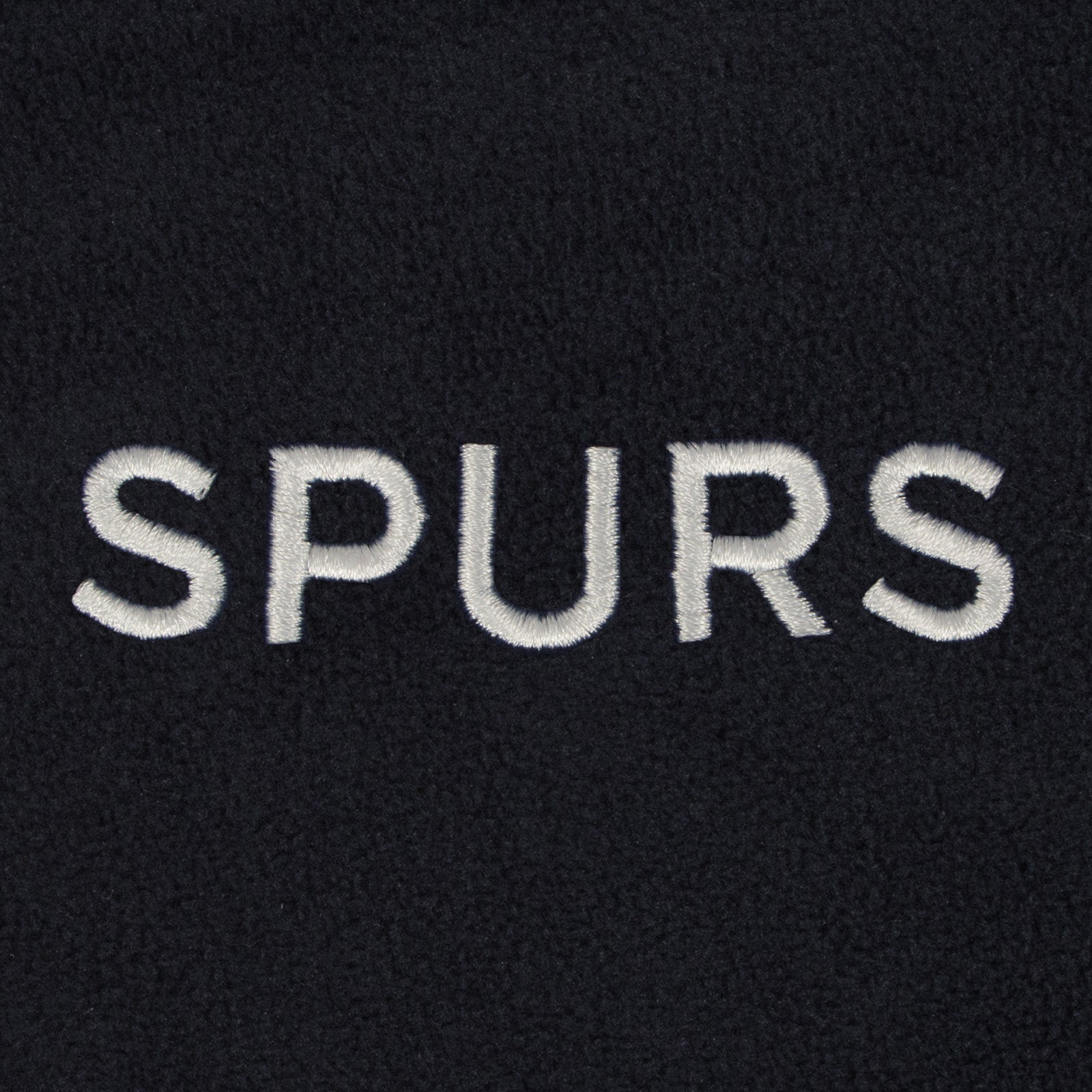 Tottenham Hotspur adults microfleece jacket in navy with a woven club crest to chest.