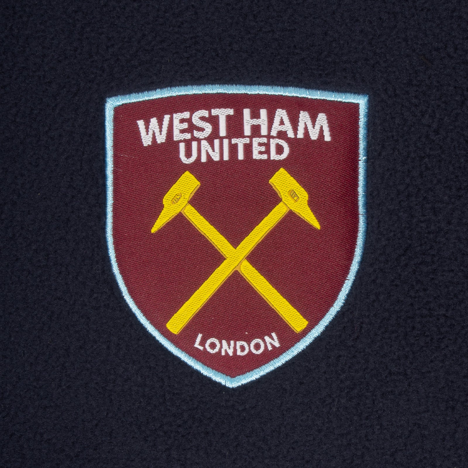 West Ham United adults microfleece jacket in navy with a woven club crest to chest.