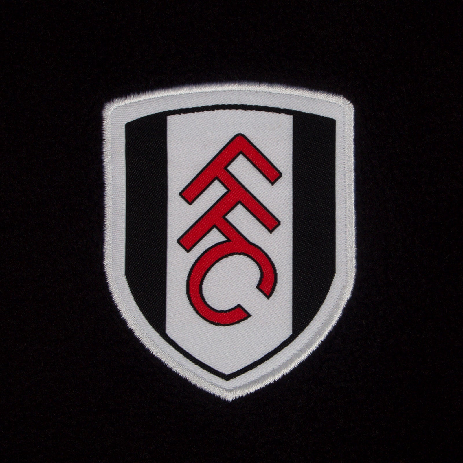 Fulham adults microfleece jacket in black with a woven club crest to chest.