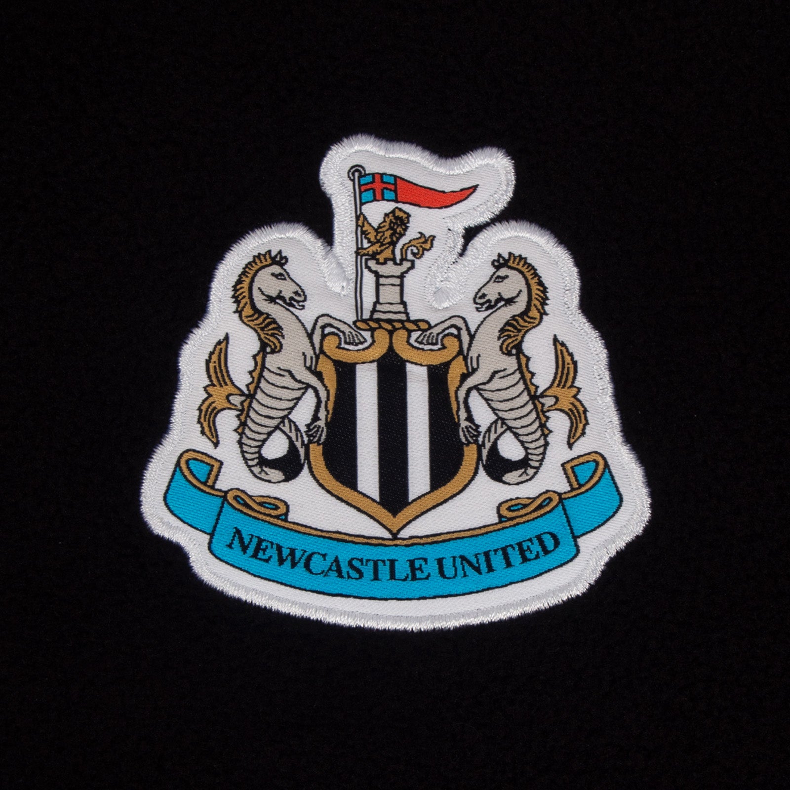 Newcastle United adults microfleece jacket in black with a woven club crest to chest.