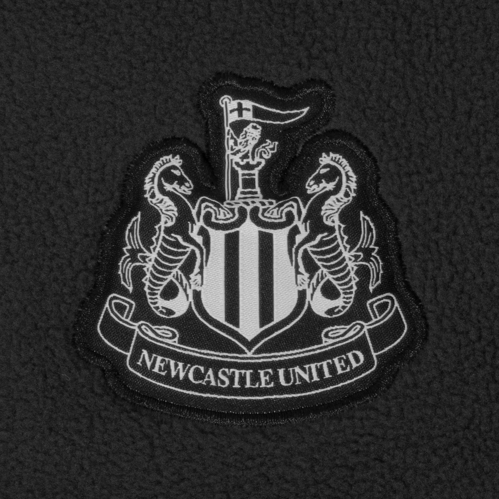Newcastle United adults microfleece jacket in grey with a woven club crest to chest.
